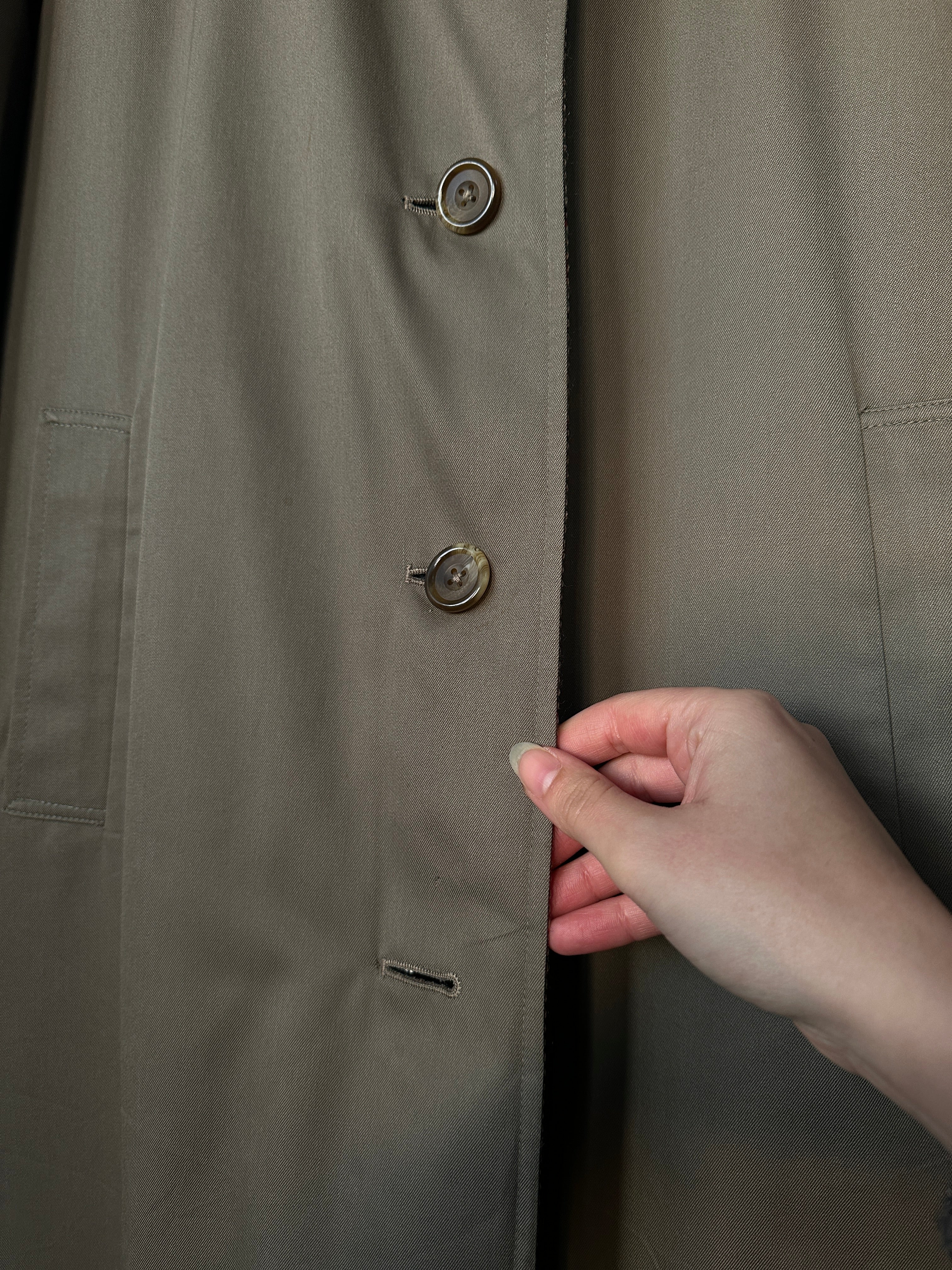 Vintage British vintage reversible wool trench coat in size S, showing the classic tailored style and dual fabric design.