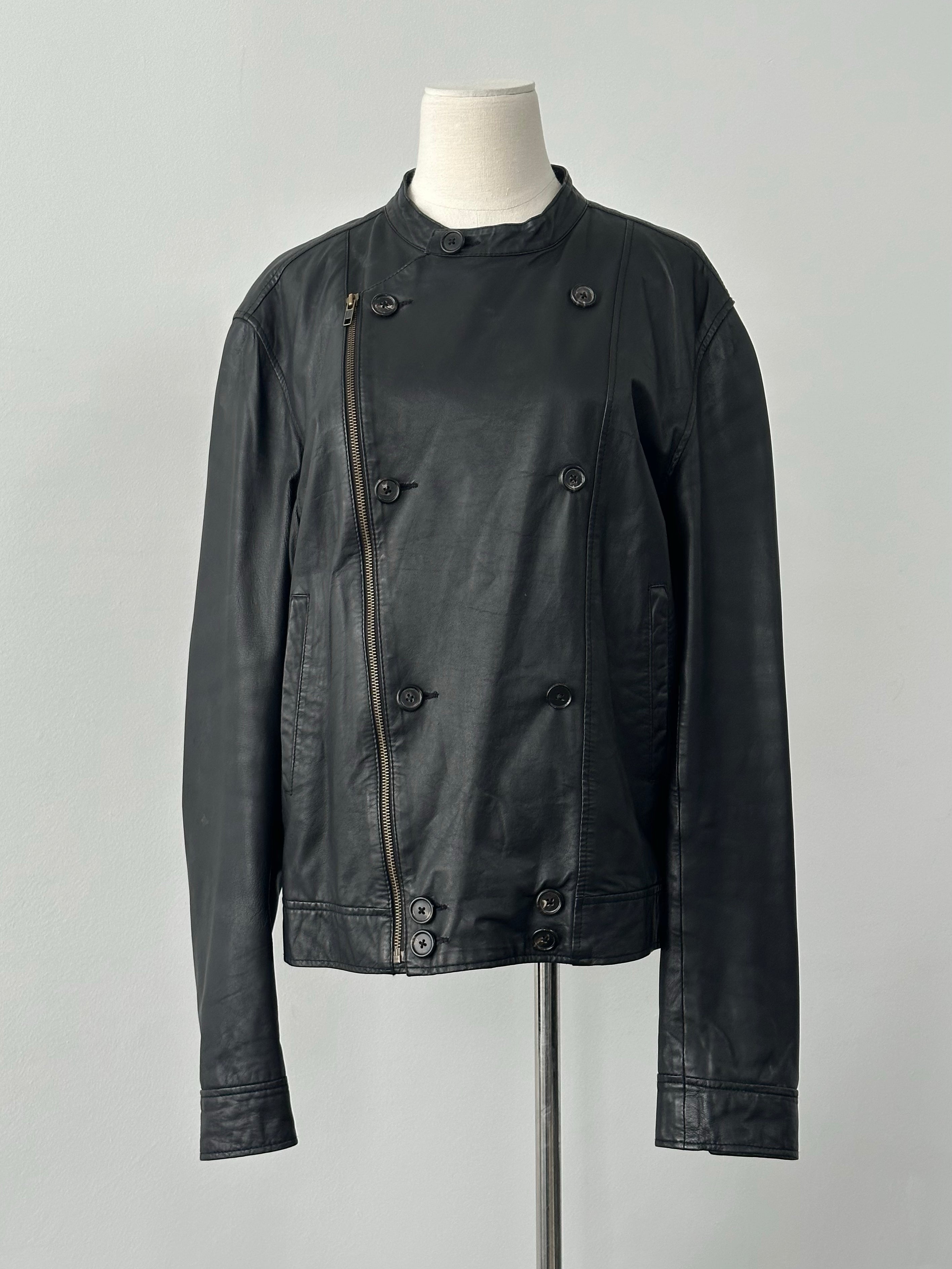 Vintage 1990s double-breasted leather jacket, men's size M, featuring classic style and aged leather finish.