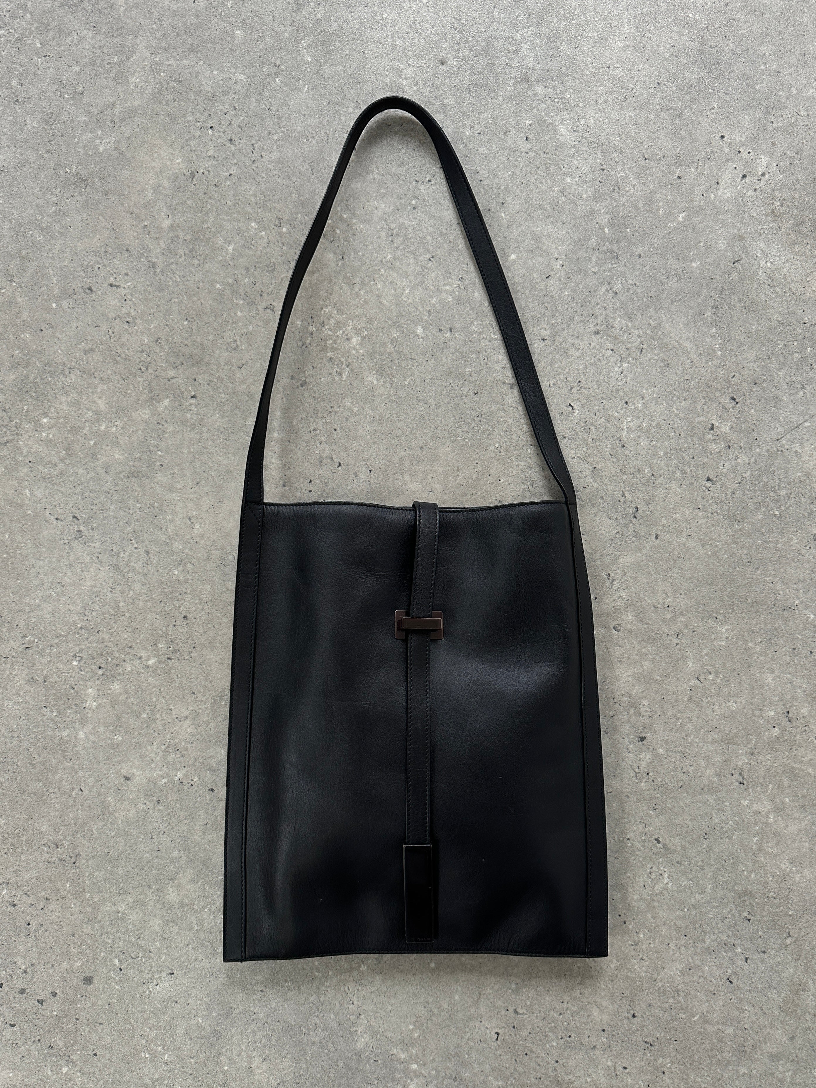 Gucci minimal rectangle leather bag with sleek design, featuring a smooth leather finish and subtle brand logo.