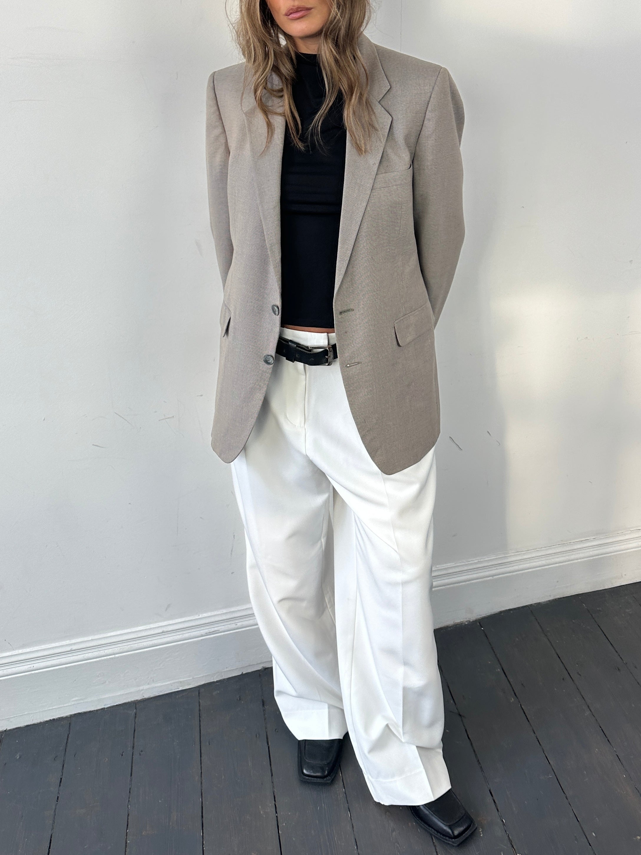 Givenchy wool single-breasted blazer in size M, tailored fit, classic lapel, and elegant design, shown on a neutral background.