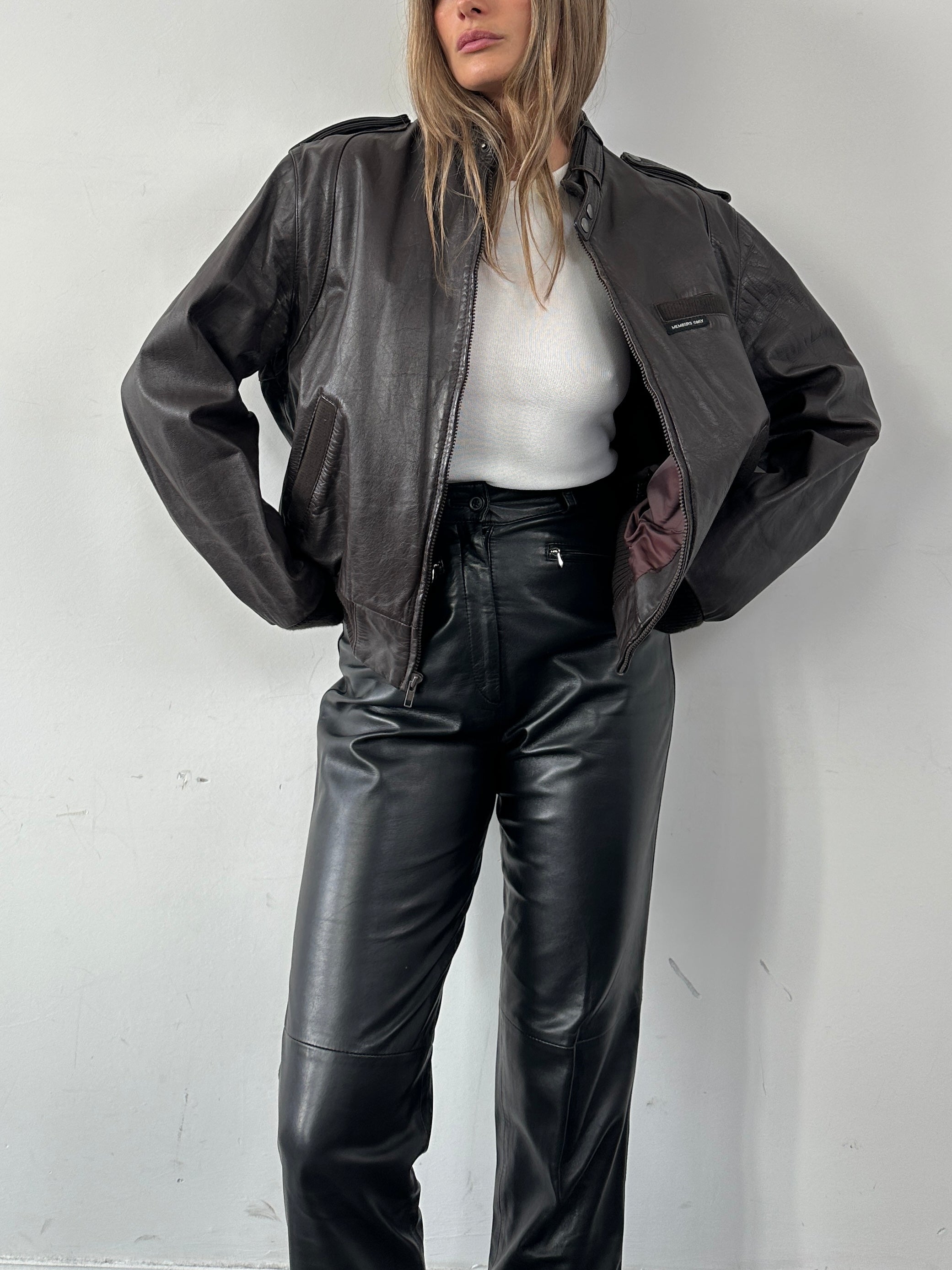 Vintage Moto Leather Bomber Jacket in size M, featuring classic design, durable leather, and ribbed cuffs and collar.
