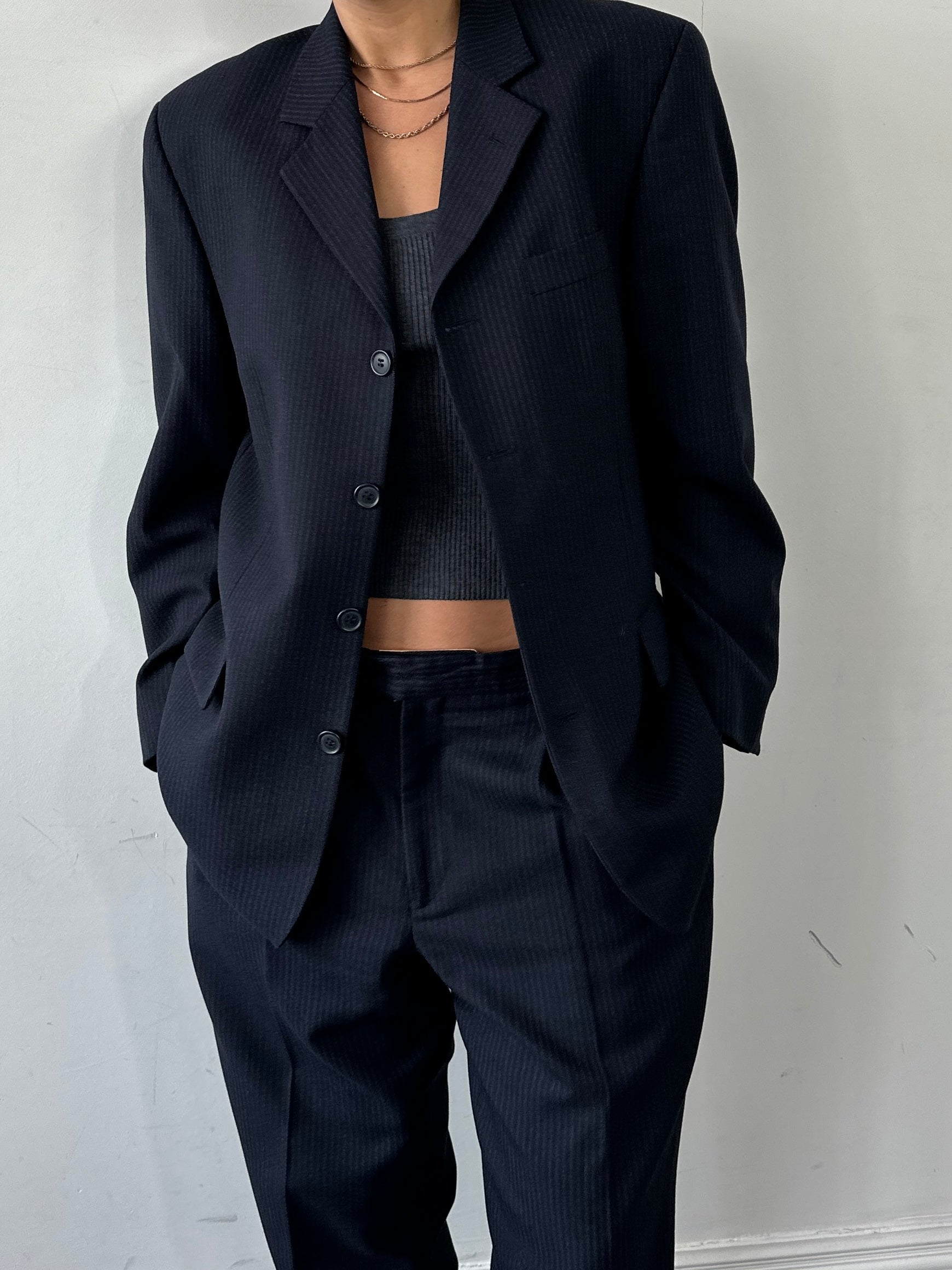 Vintage pinstripe wool jumpsuit, single-breasted suit in size 40R/W34, with classic lapels and tailored fit.