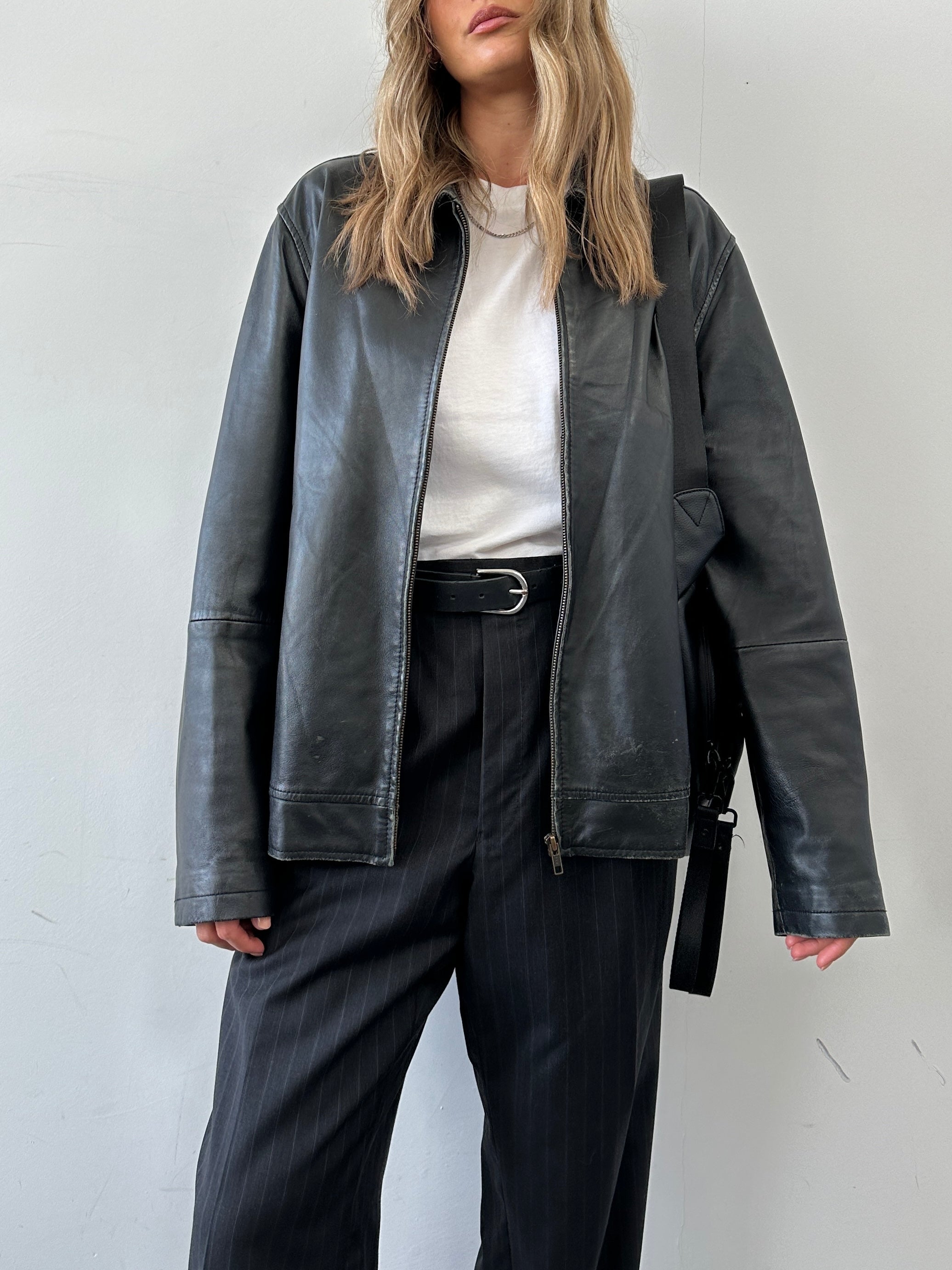 Conbipel minimal leather jacket in size L, featuring sleek design and smooth leather material, displayed on a neutral background.