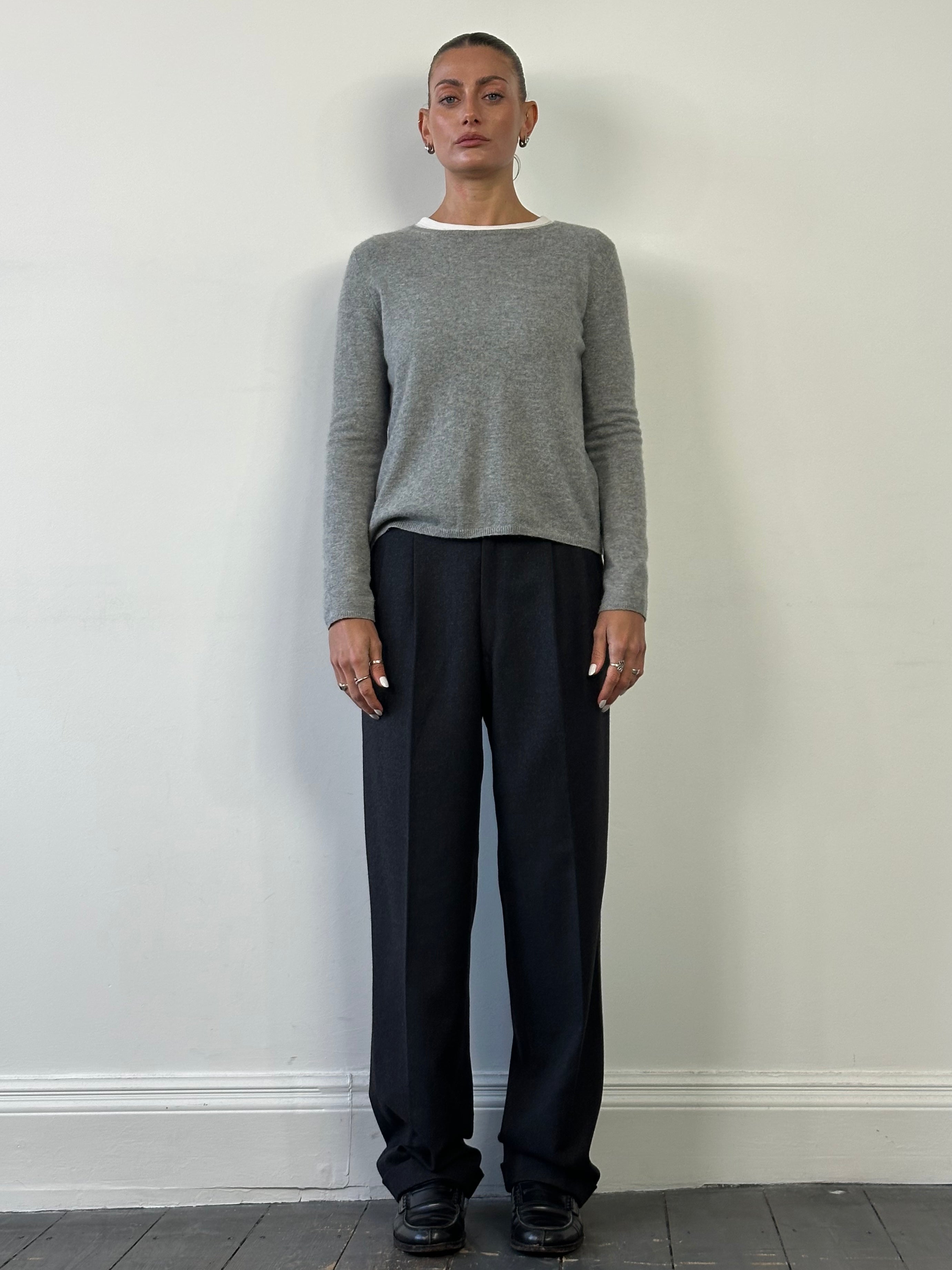 Italian vintage 90s pure wool tailored trousers in size W32, featuring classic fit and detailed stitching.