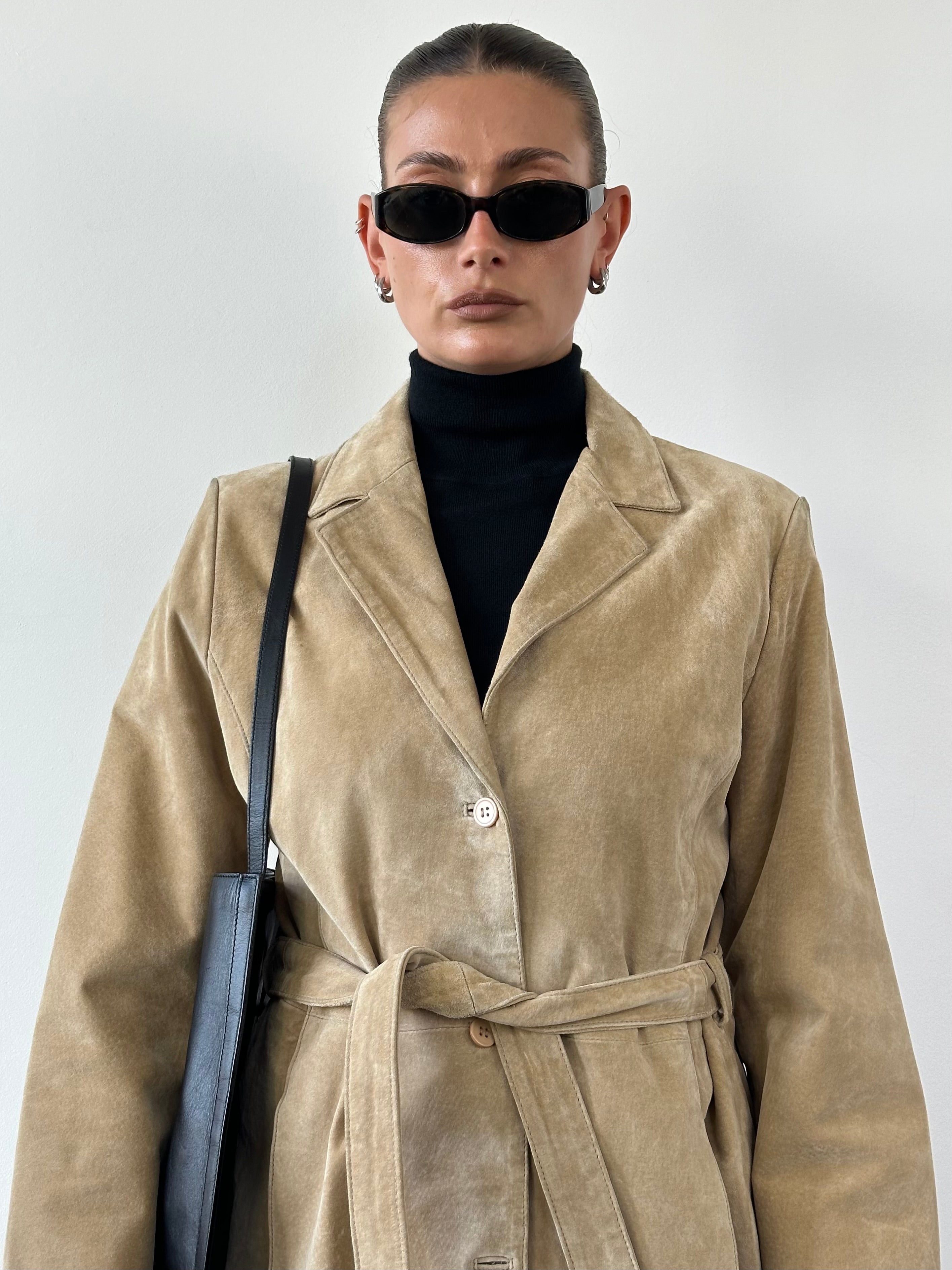 Vintage suede belted jacket in size M/L, featuring classic design and stylish details, perfect for casual and retro outfits.