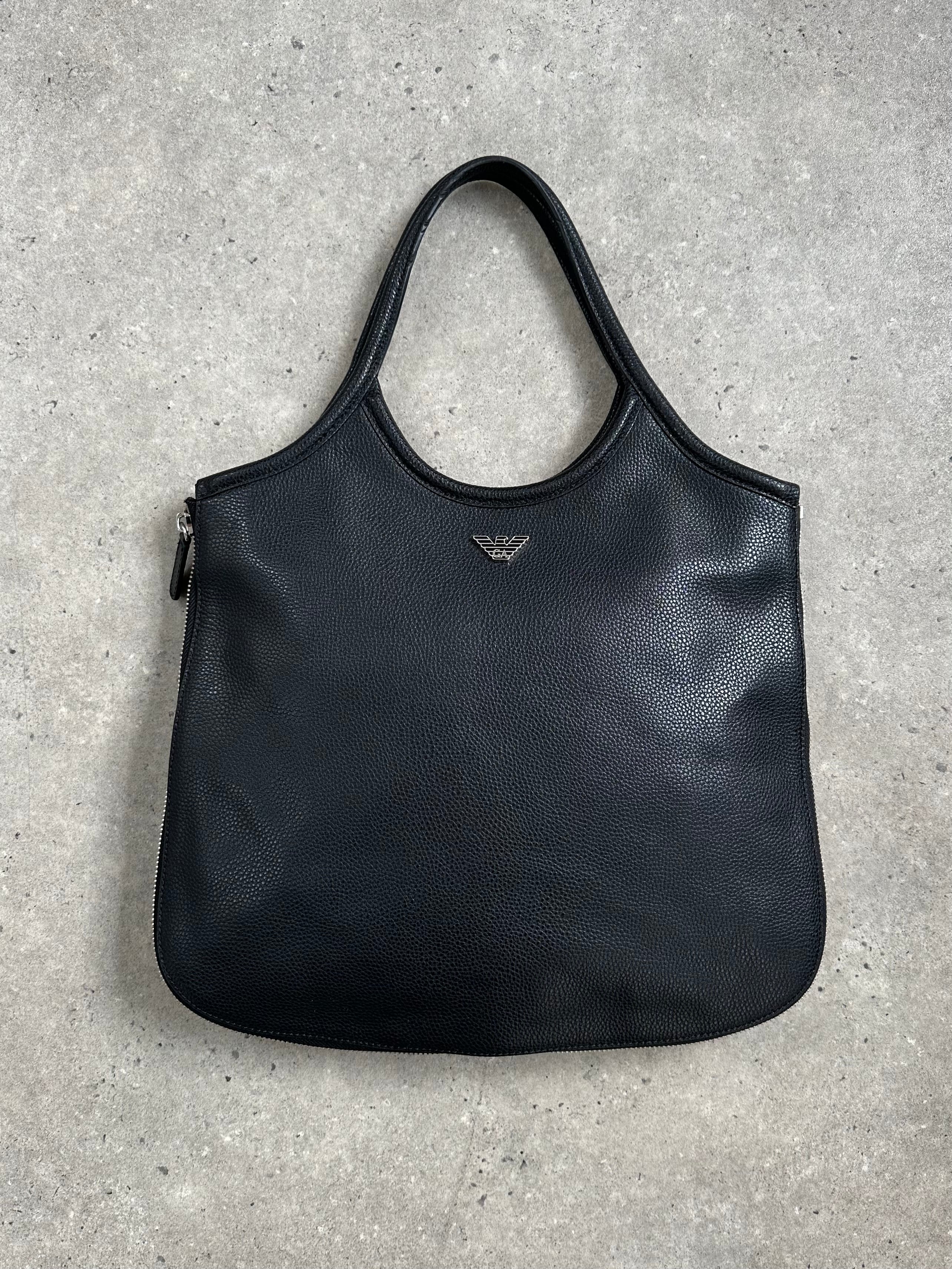 Emporio Armani leather shoulder bag from the 1990s with a sleek design, featuring a classic brown leather finish and subtle branding.