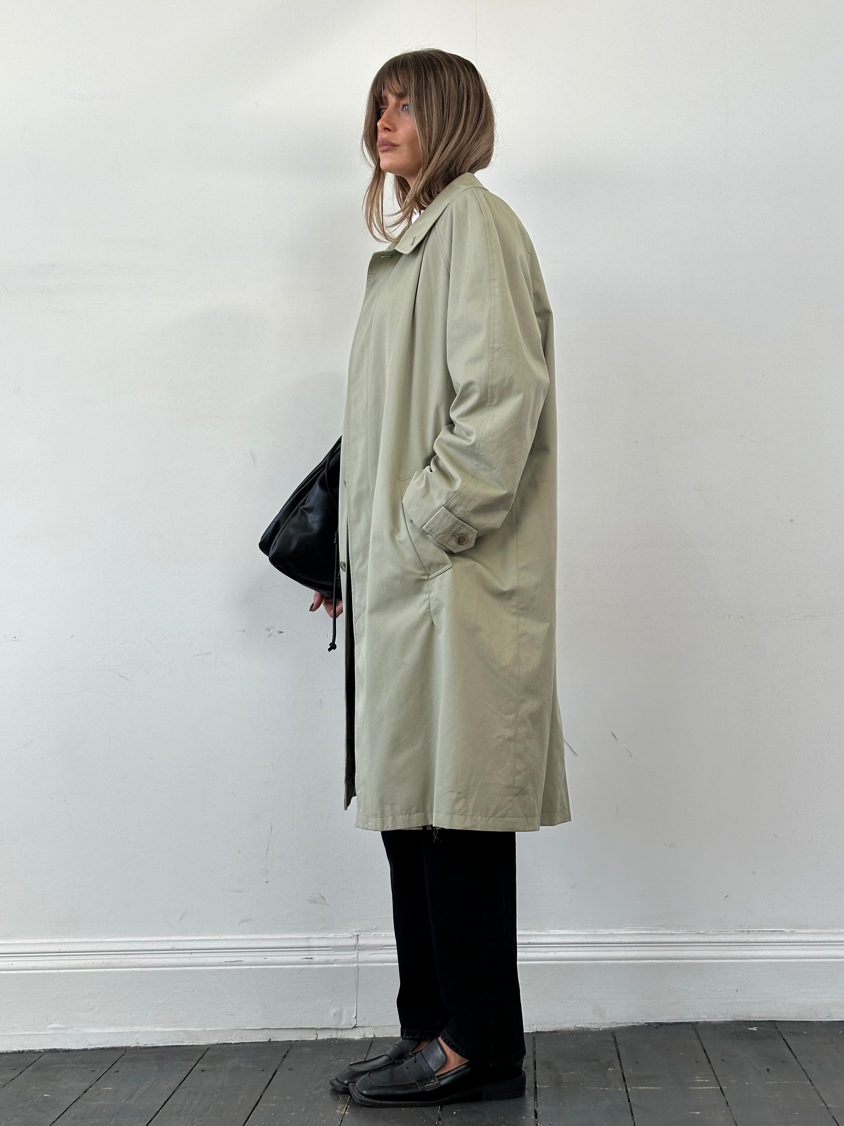 Yves Saint Laurent concealed placket trench coat in XXL, beige fabric with classic collar and double-breasted design.