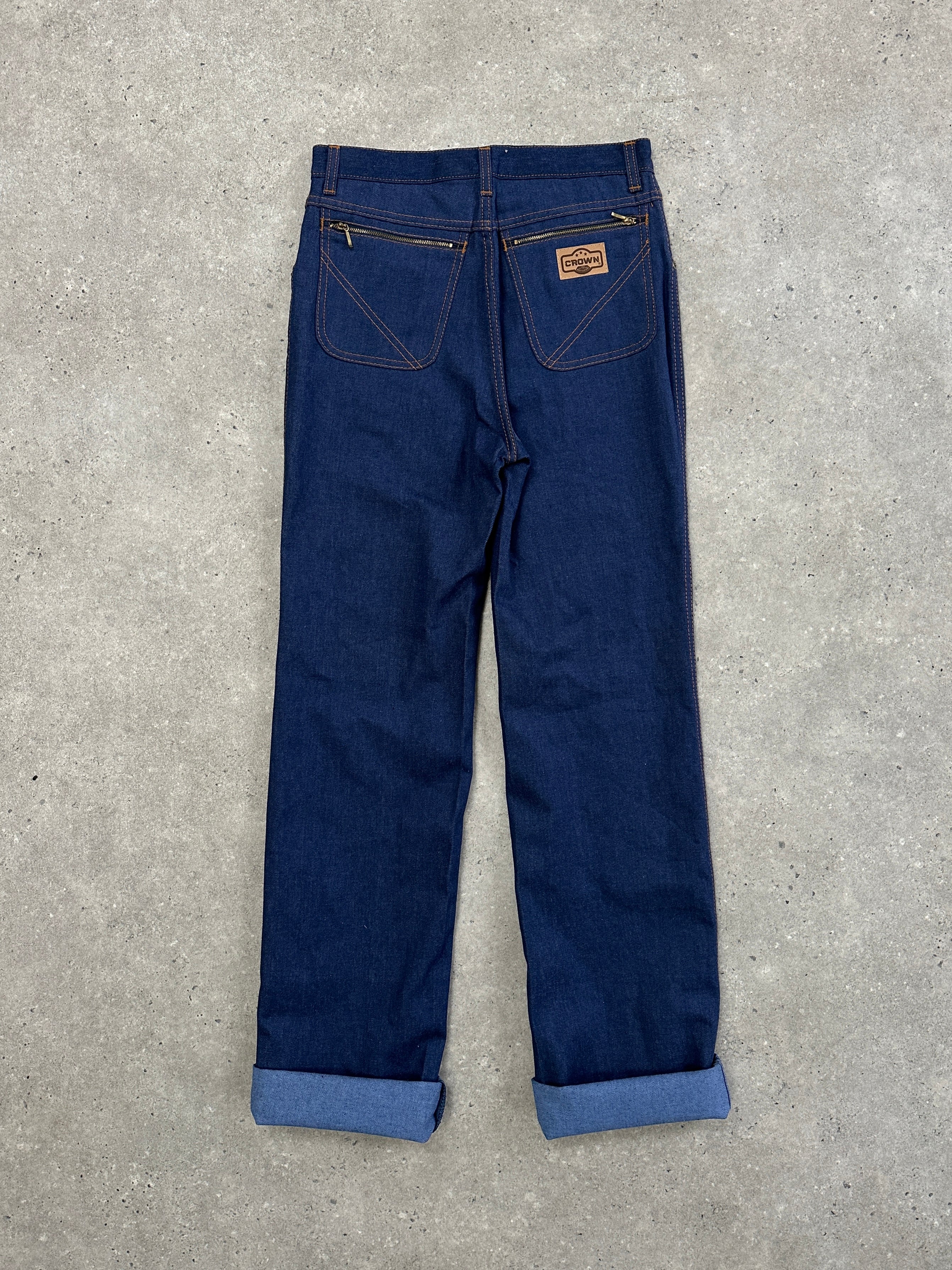 Vintage Italian 1990s high-waisted straight leg denim jeans, size W28, classic vintage style with faded blue denim.