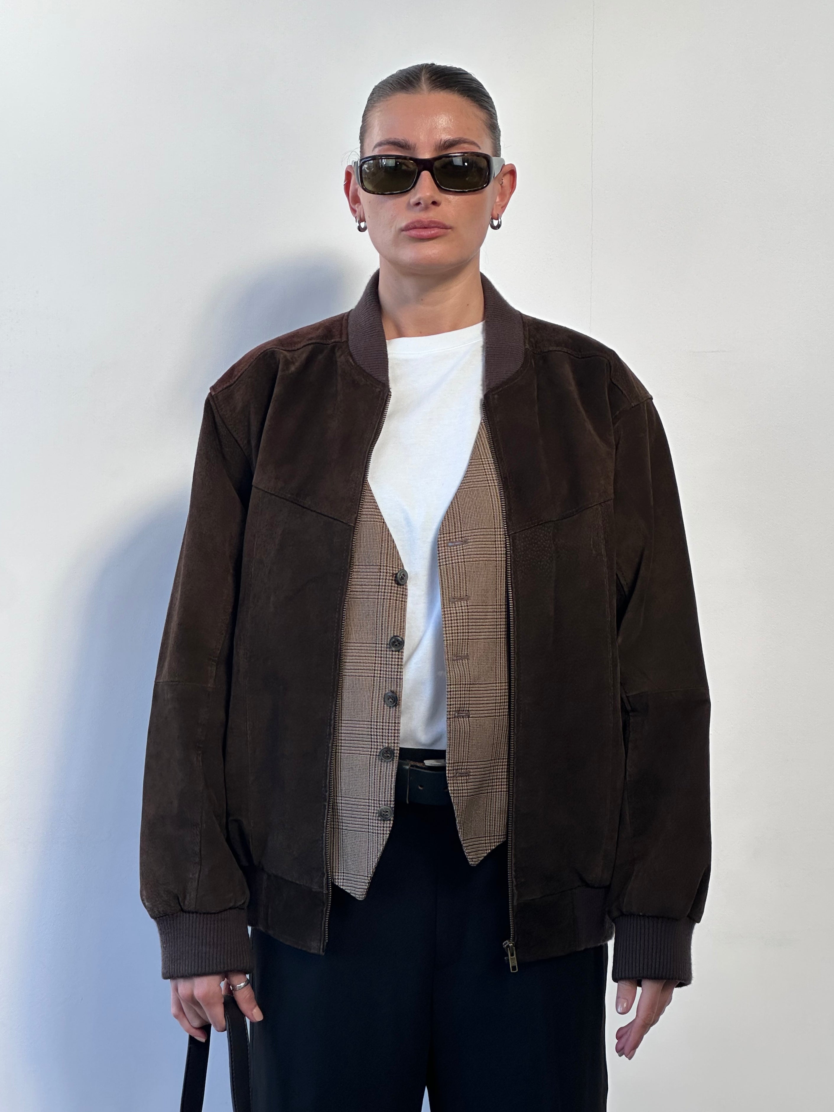 Vintage suede bomber jacket in size large, featuring classic leather style with a textured, vintage finish and ribbed collar.