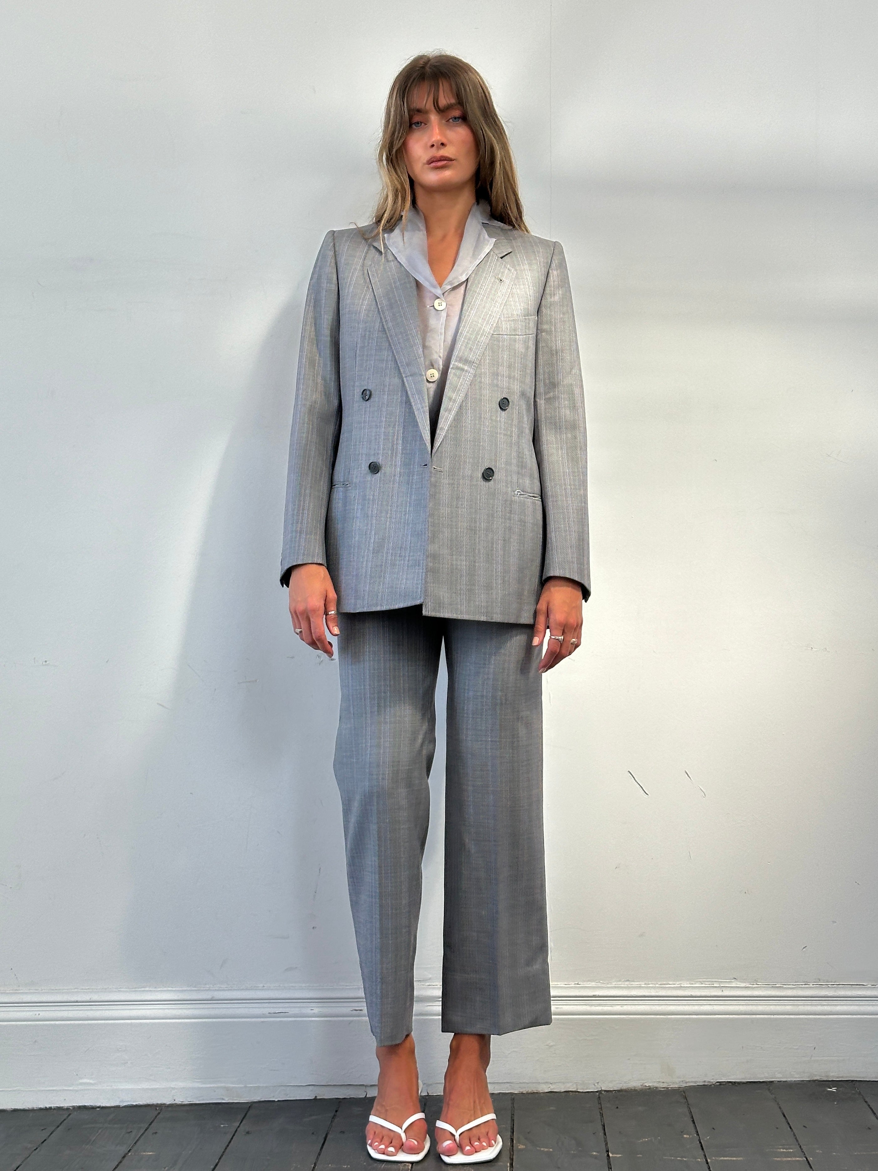 Vintage Italian vintage pure wool stripe double-breasted suit in size 36R/W28, tailored with classic lapels and structured fit.