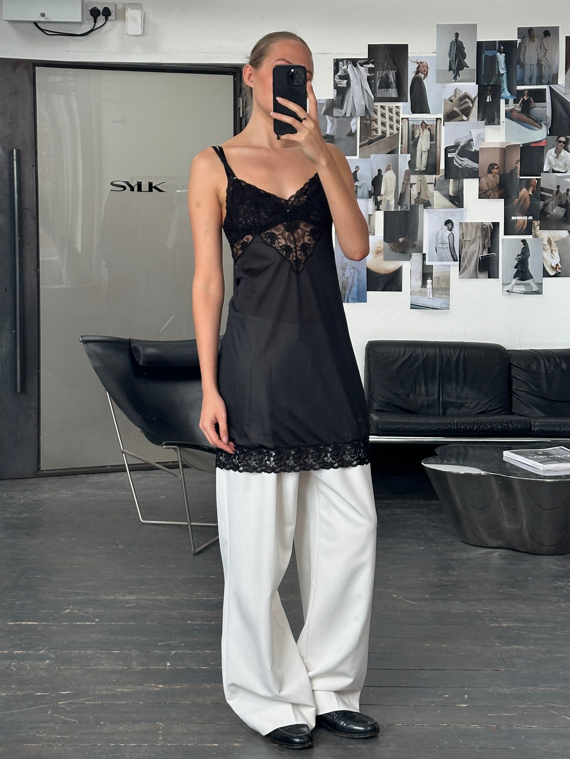 Vintage 1990s lace mini slip dress in S/M, featuring delicate lace fabric and a classic vintage style.