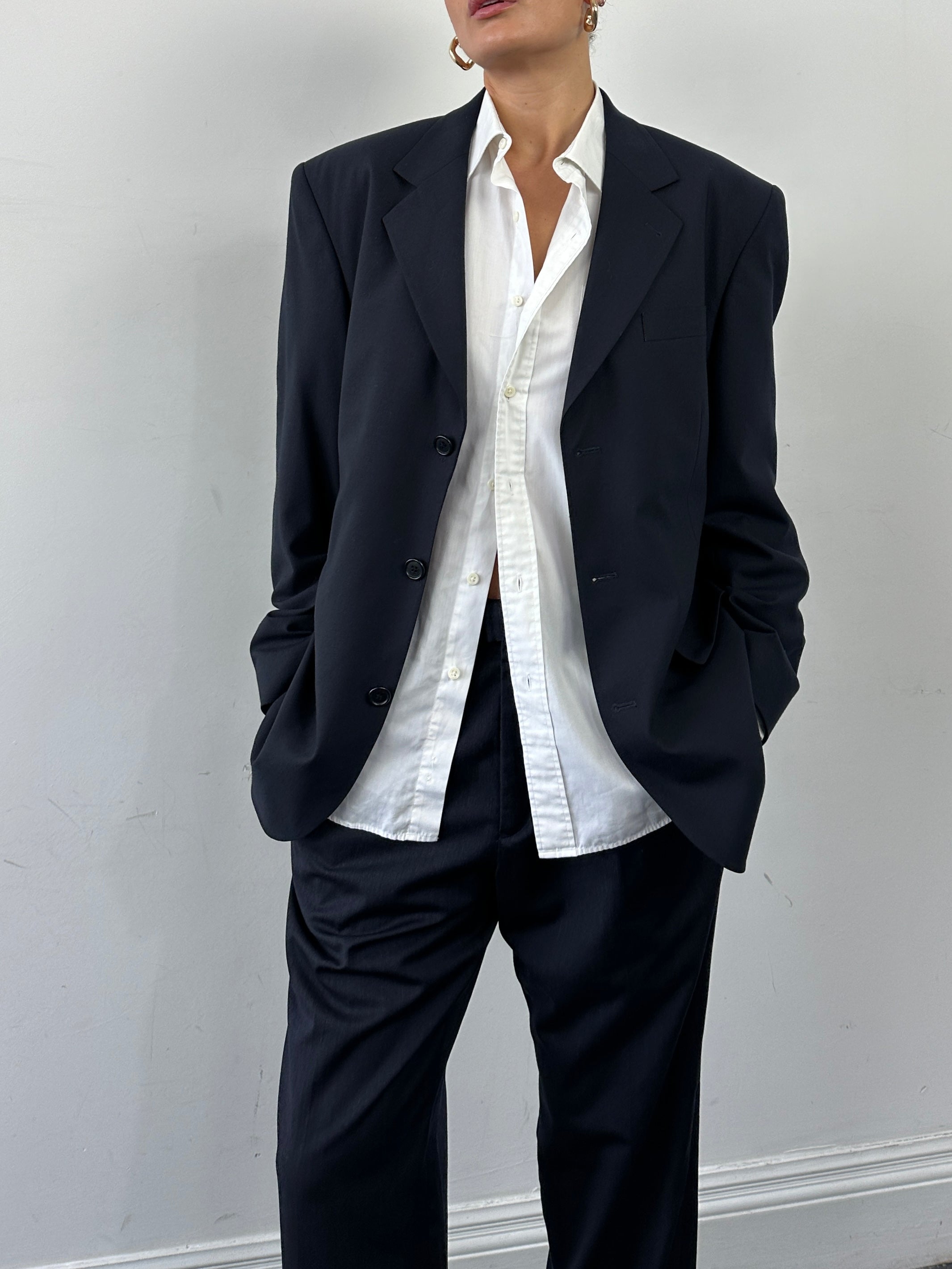 Vintage Virgin Wool Single Breasted Blazer in size 40R/L, tailored fit, classic style, dark navy color, detailed lapels and buttons.