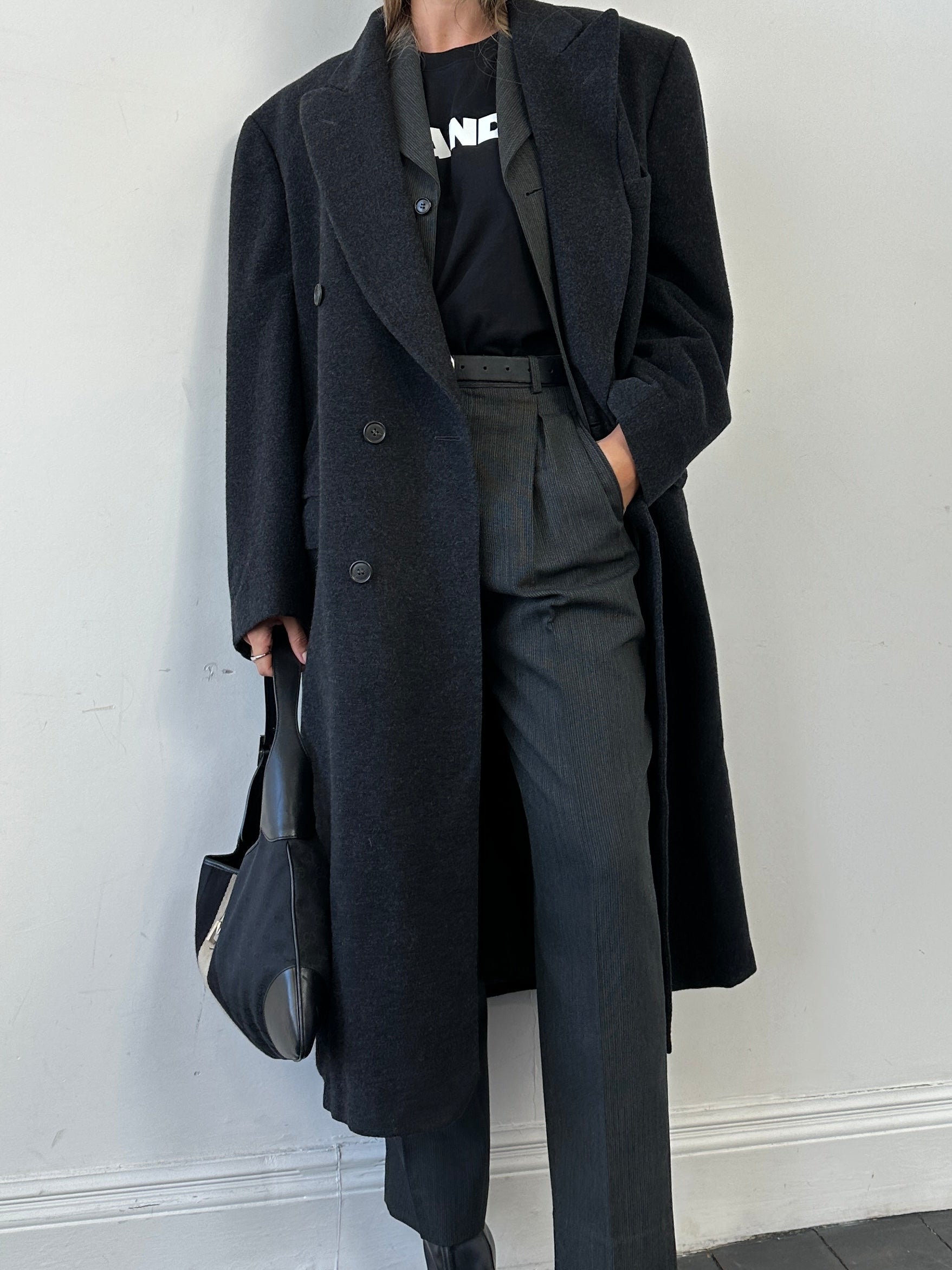 Vintage brand vintage cashmere wool double-breasted coat in XL size, shown in dark color with classic lapel design.