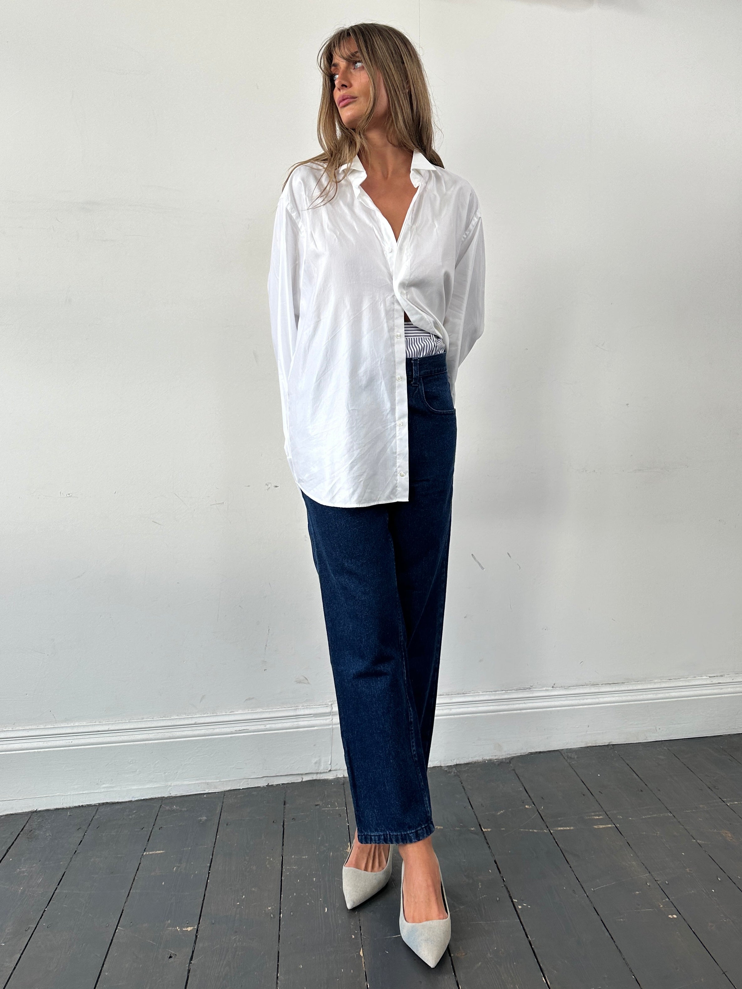 Vintage high waisted straight leg denim jeans in W30, showcasing classic fit and light blue wash, front view.