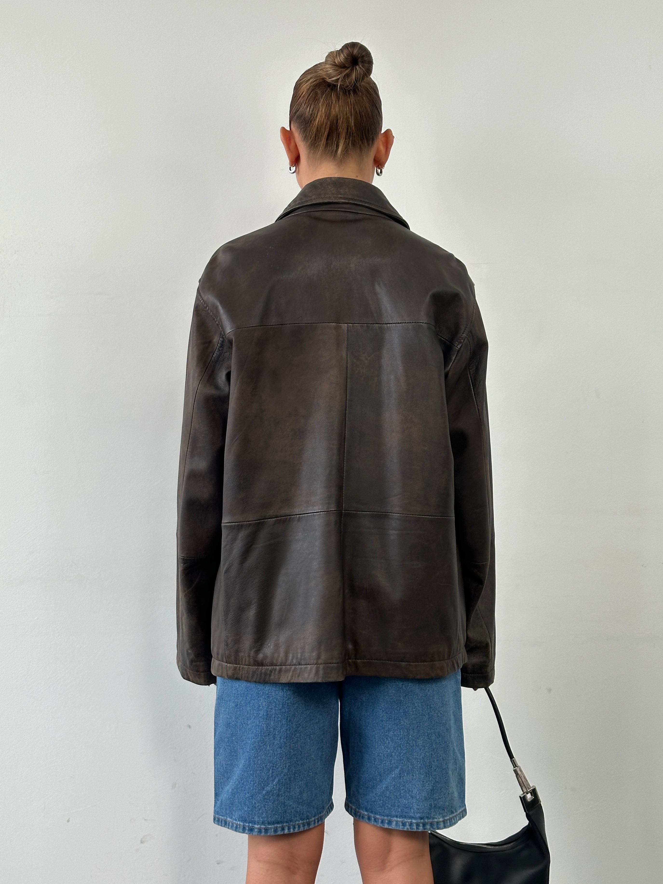 Vintage minimal aged leather jacket in XL size, featuring a classic design with a worn-in, vintage look and textured leather finish.