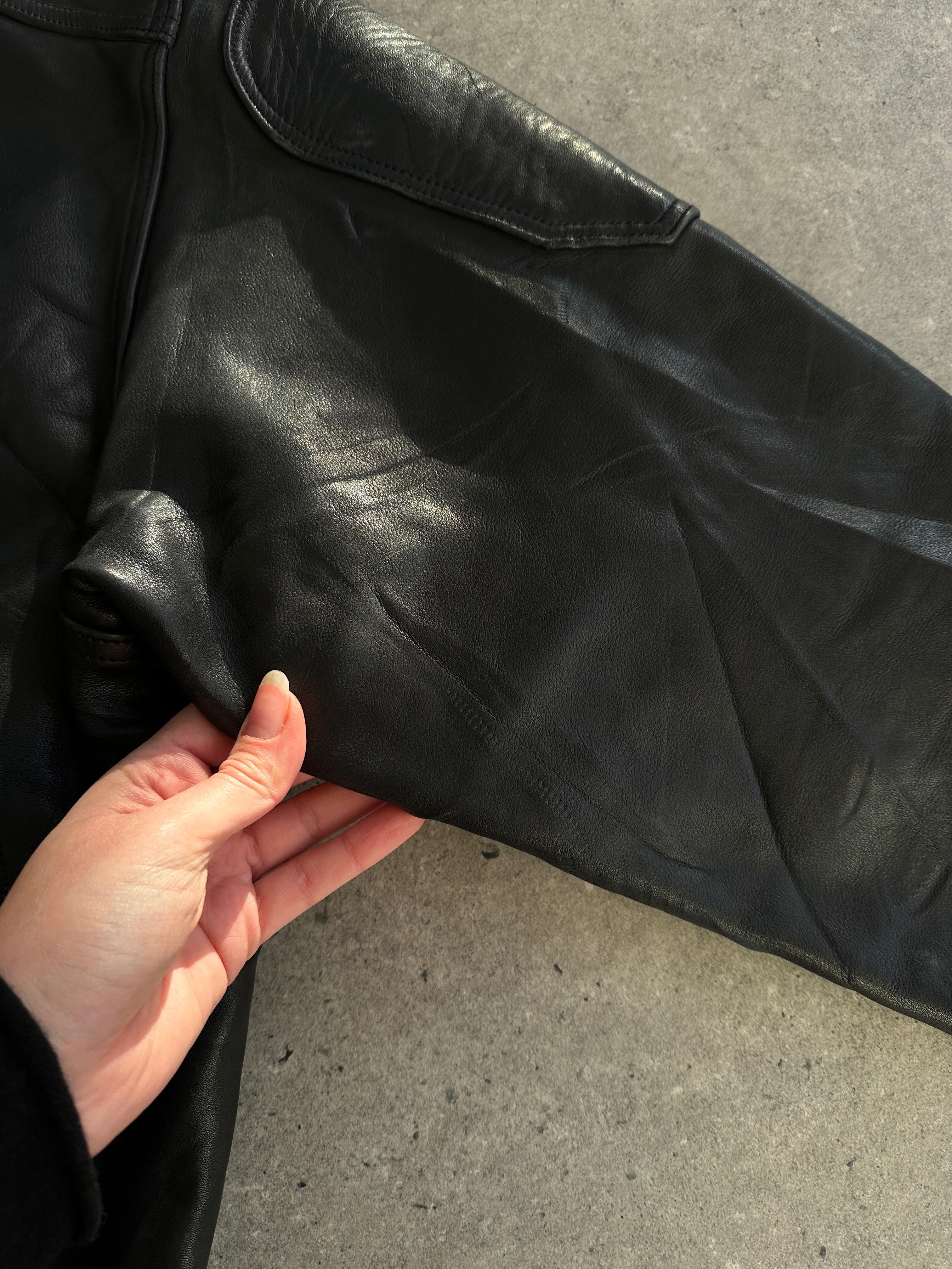 Vintage Leather Jacket in XL size, showcasing classic design with distressed leather and stylish collar detail.