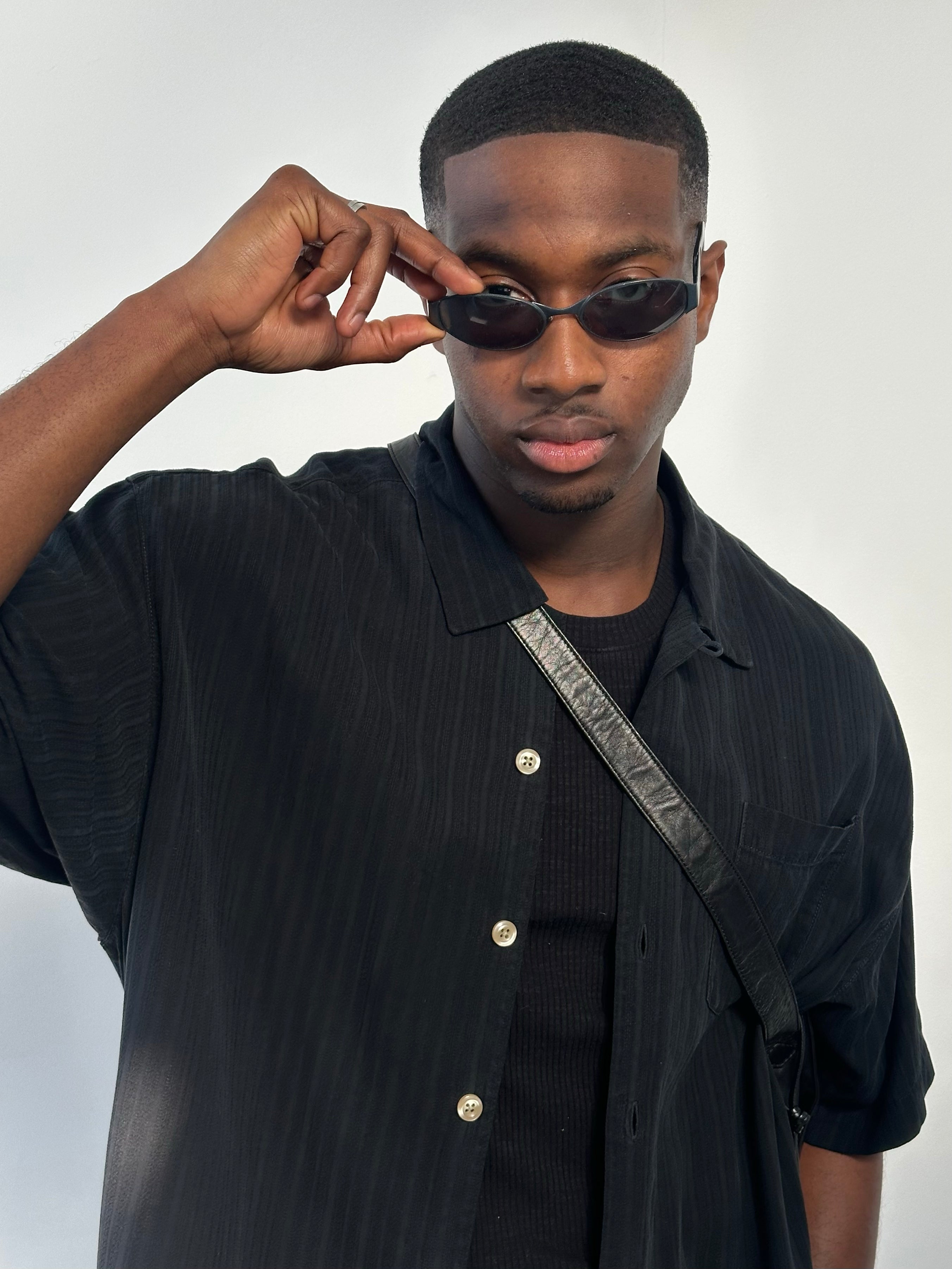 Vintage 2000s pure silk relaxed short sleeve shirt in XL, featuring soft fabric and classic design, displayed on a hanger.