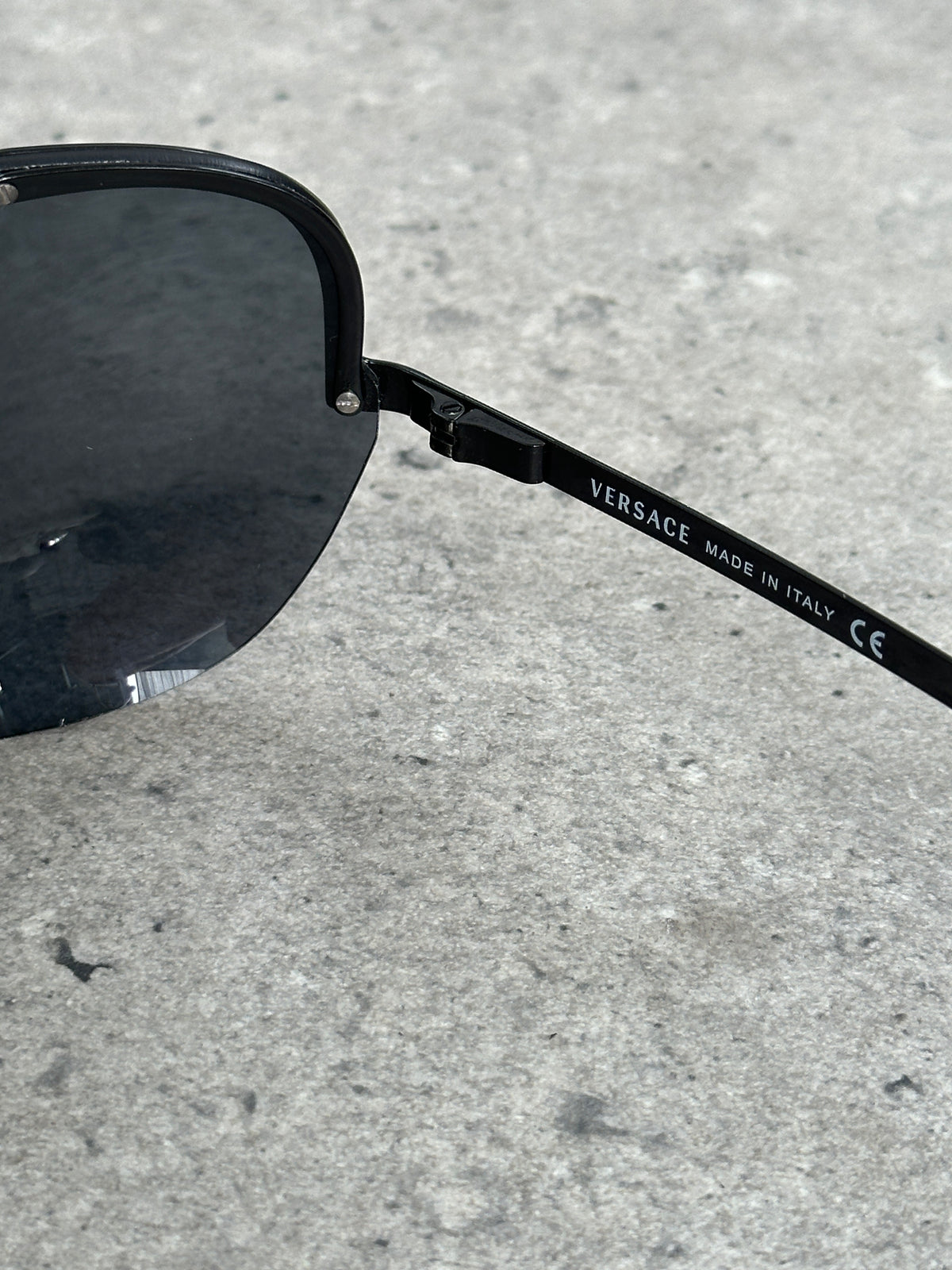 Versace 2000s Shield Aviator Logo Sunglasses with bold metal frame and iconic Versace logo on the temples.