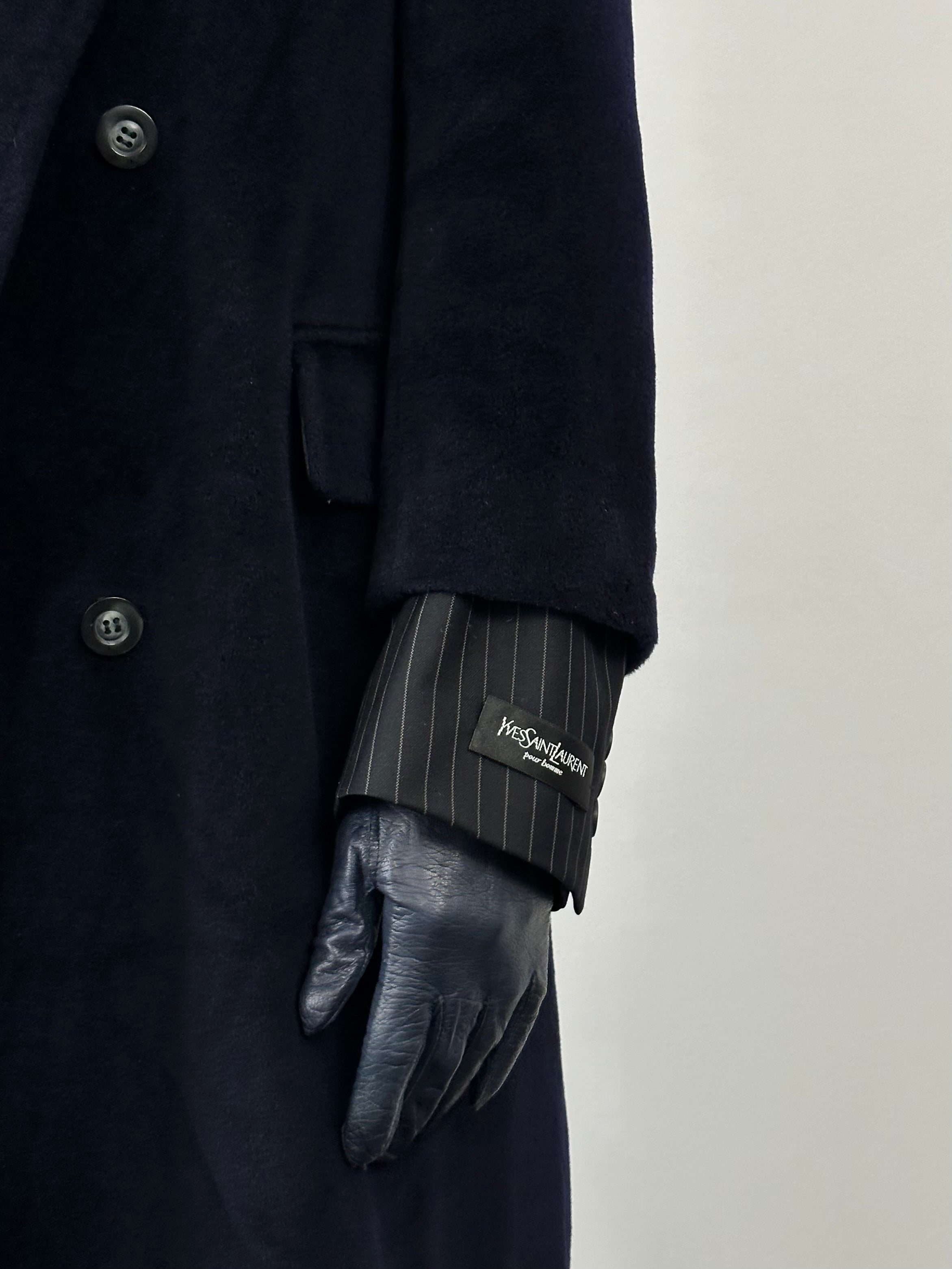 Max Mara pure wool double-breasted coat in size M displayed on a hanger, showcasing classic tailored design and neutral color.