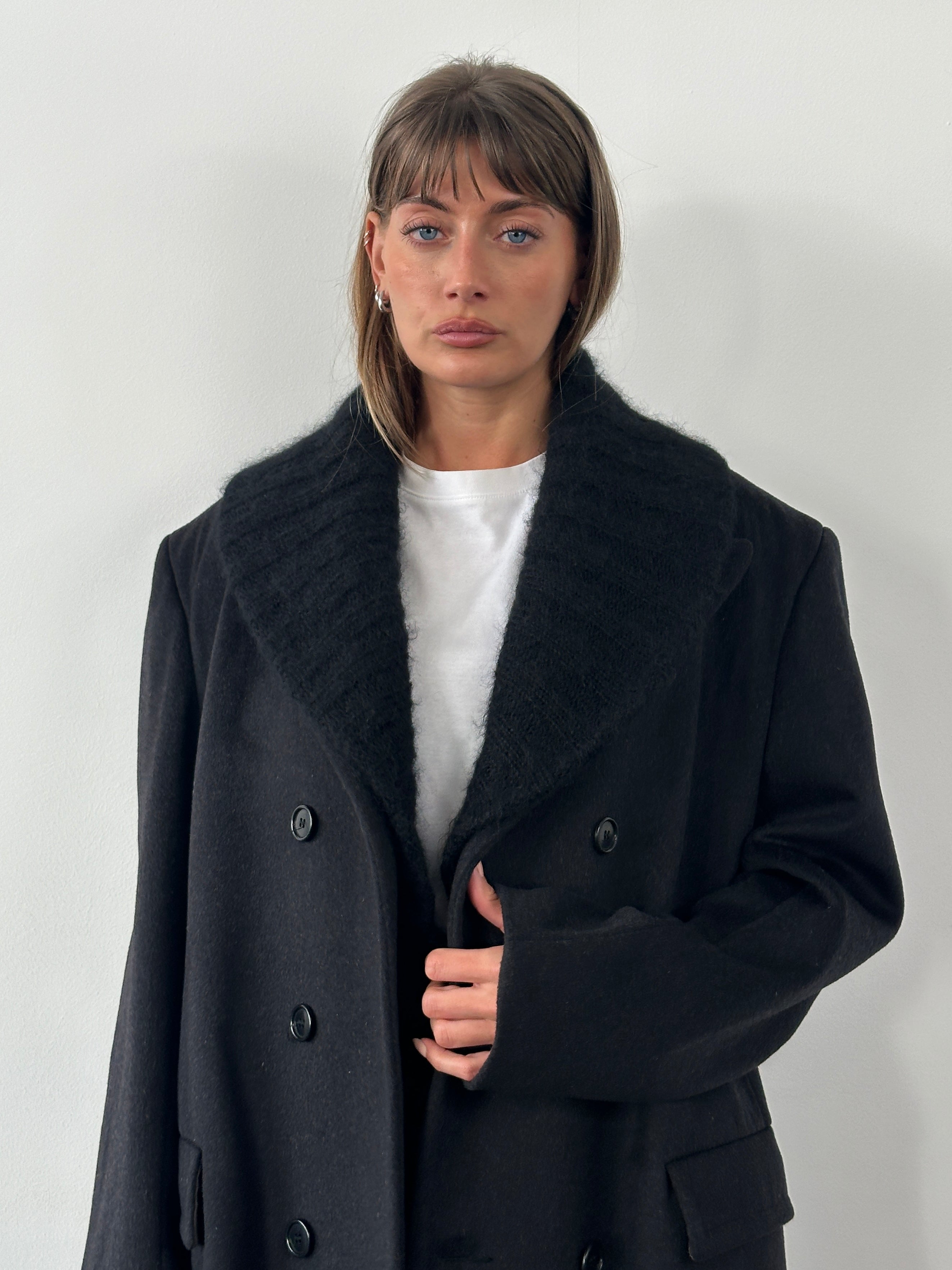 Elegant vintage Armani 1990s pure Merino wool knitted scarf, showcasing intricate patterns and soft, warm wool fibers.