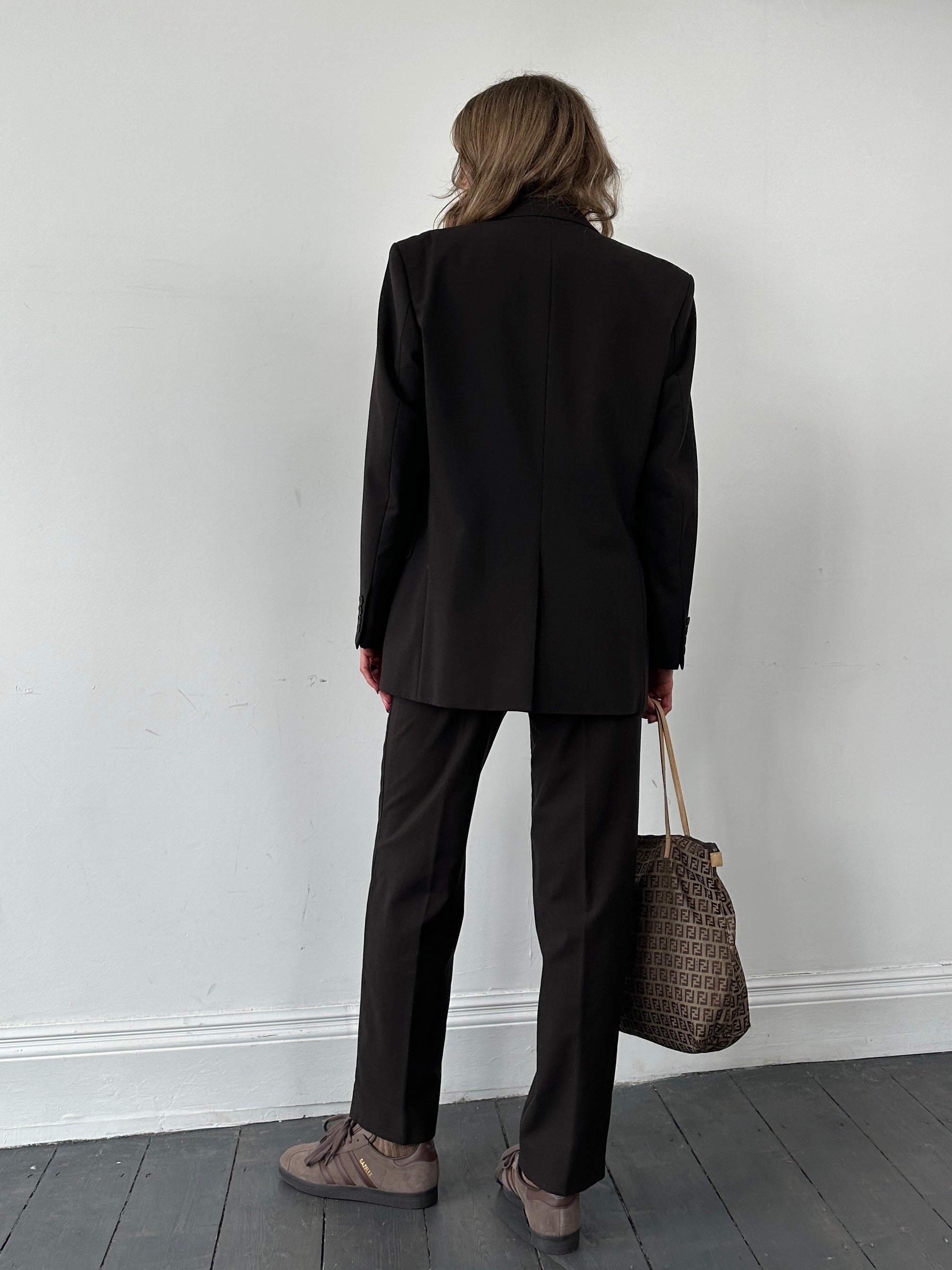 Vintage wool single-breasted jumpsuit in size 38R/W28, featuring classic tailored design and button-front closure.