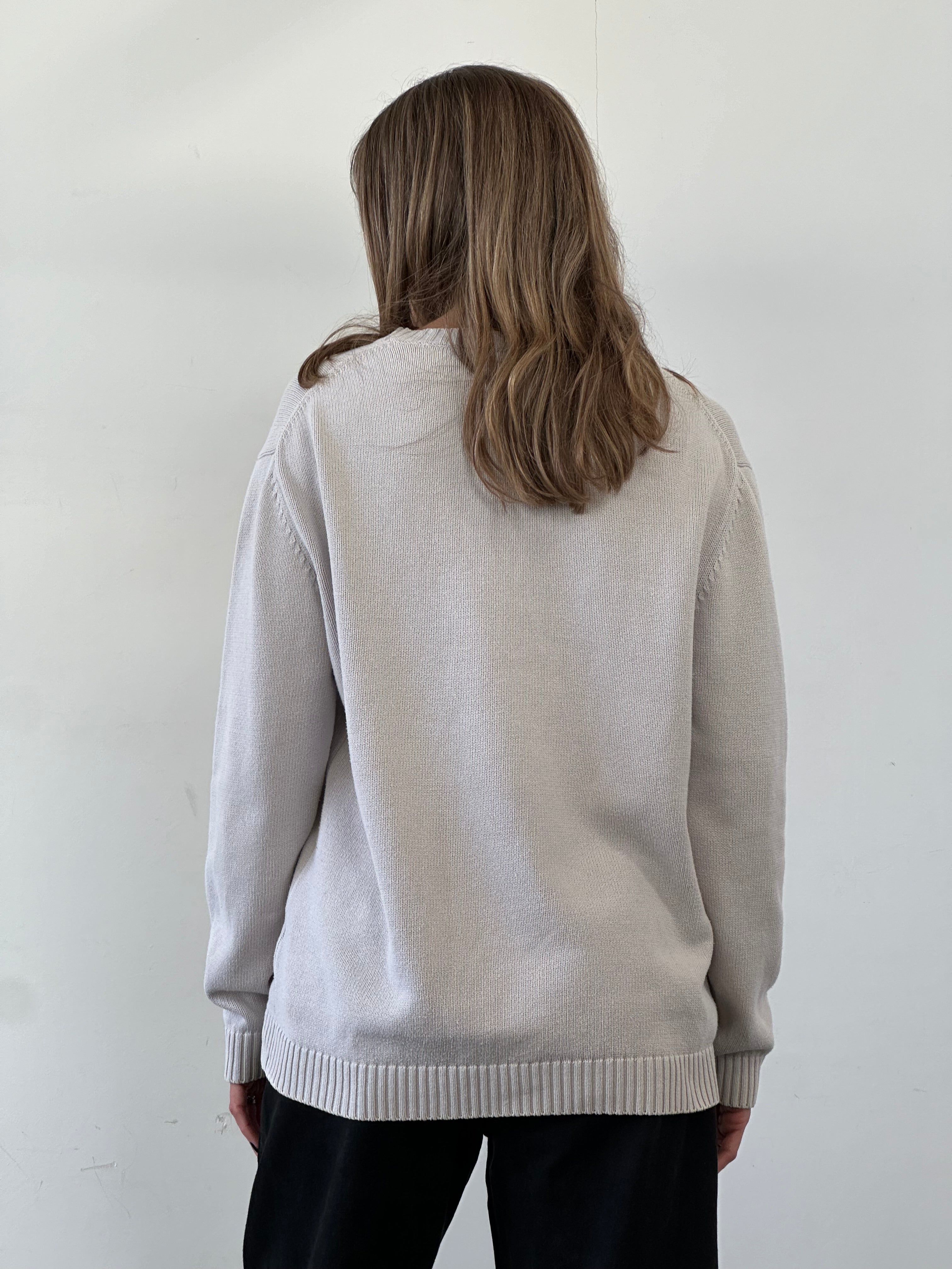 Yves Saint Laurent Pour Homme cotton knitted jumper with logo, showing a close-up of the soft fabric and embroidered brand detail.