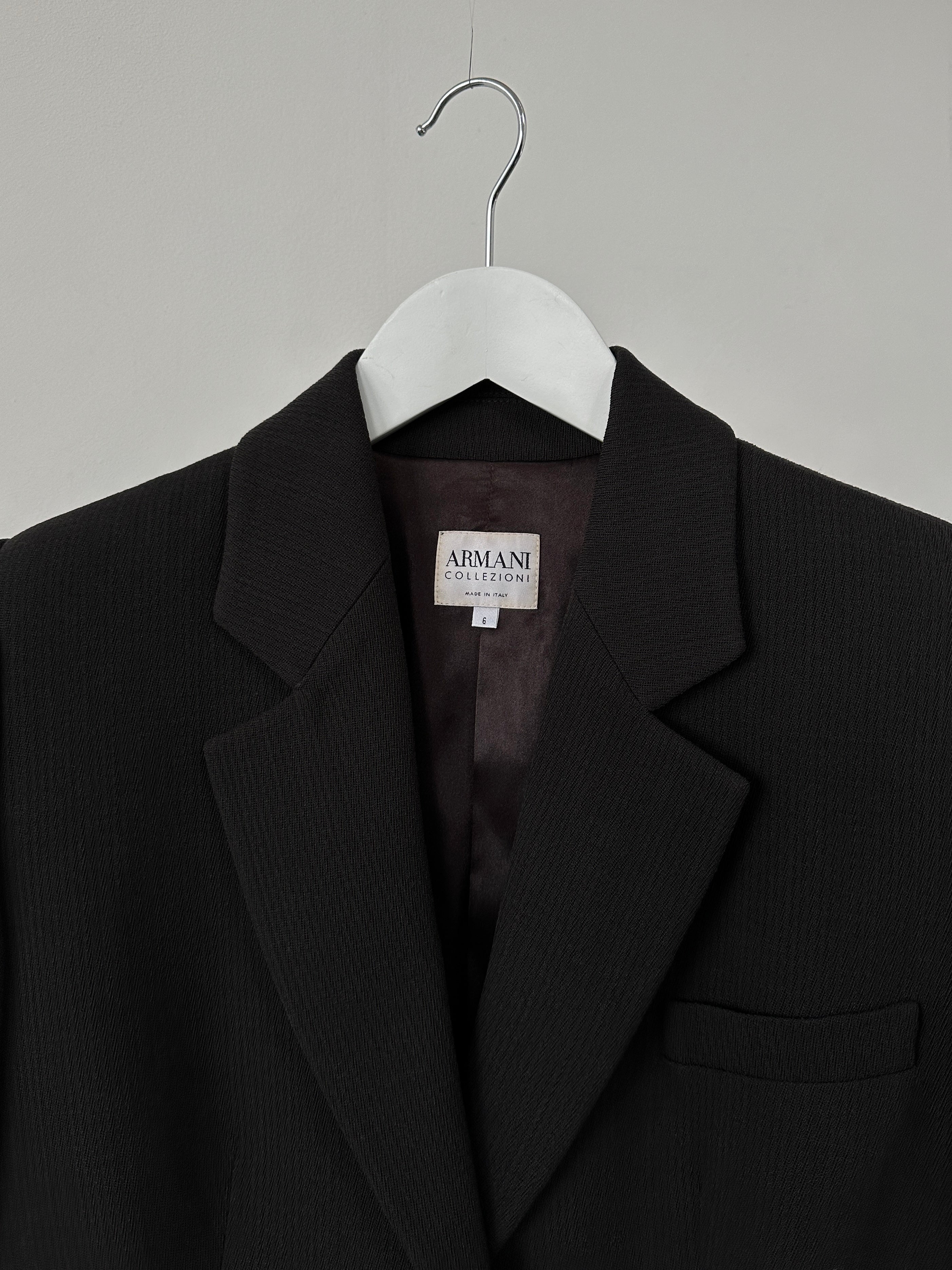 Armani Collezioni fitted single-button blazer in classic style, tailored fit, in a neutral color with lapel collar and sleek design.