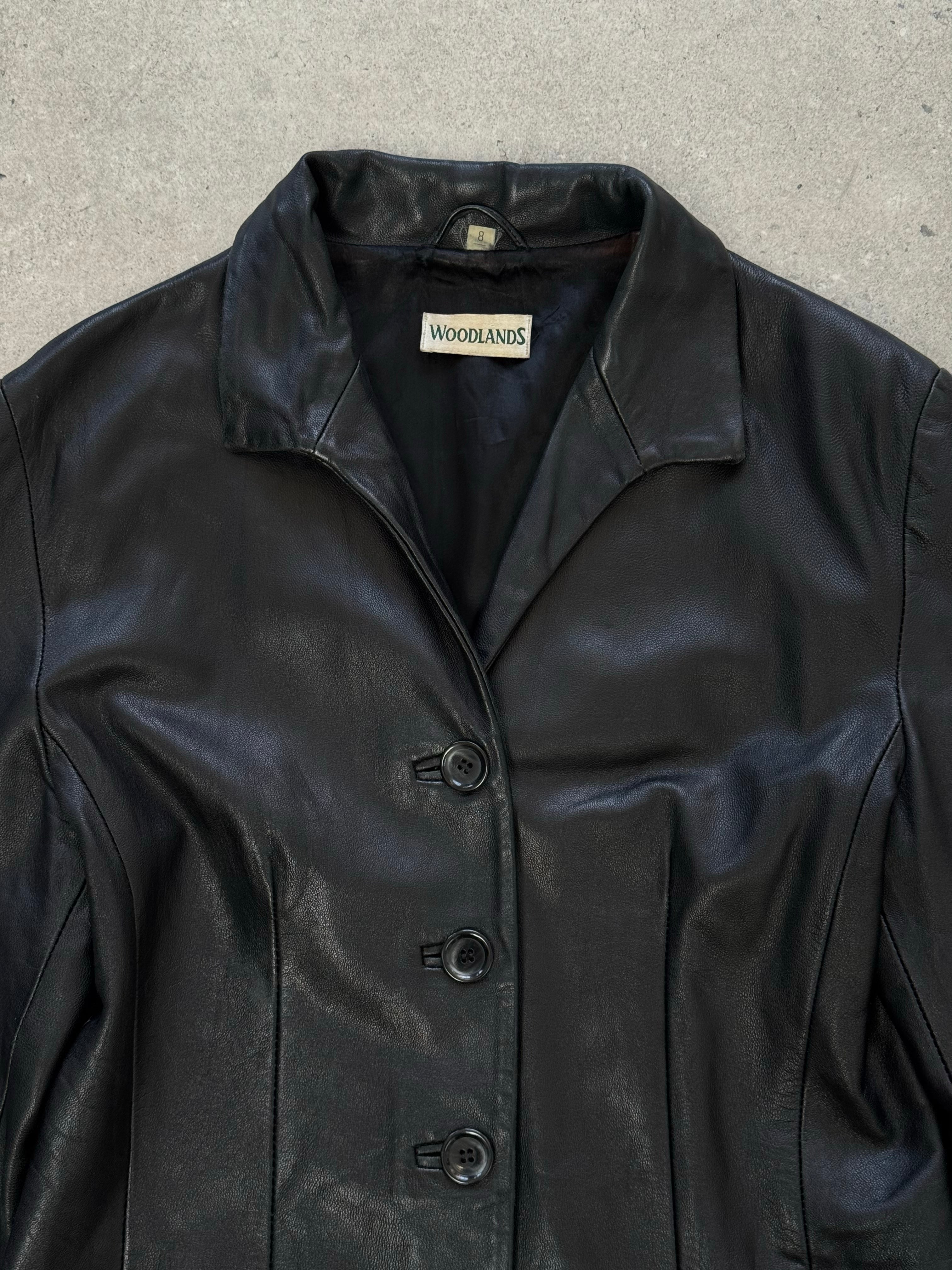 British Vintage 1990s fitted leather jacket by Vintage, front view showing classic collar, zipper closure, and tailored fit.