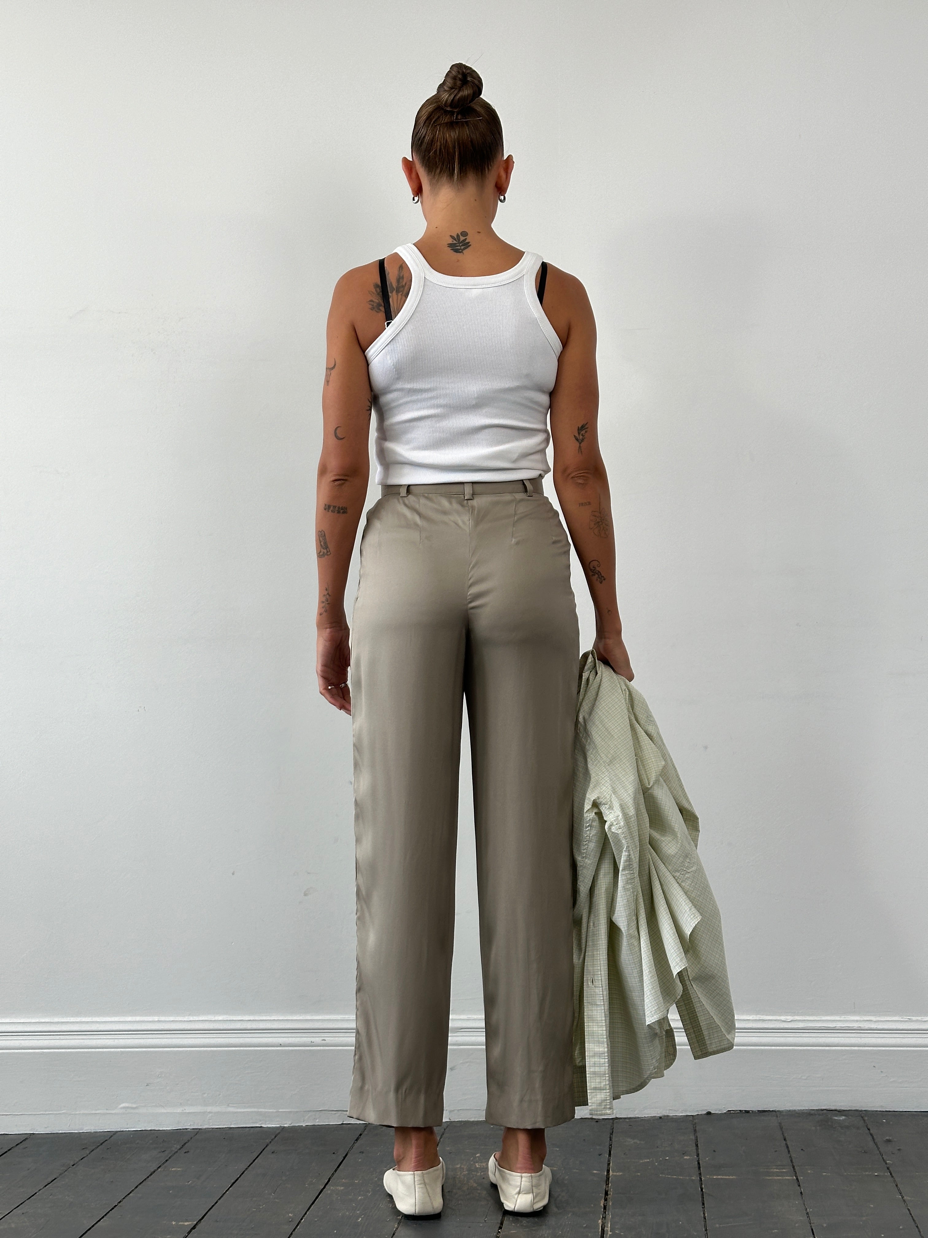 Mani Pure Silk high-waisted trousers in W26, showcasing smooth silk fabric, tailored fit, and sleek design.