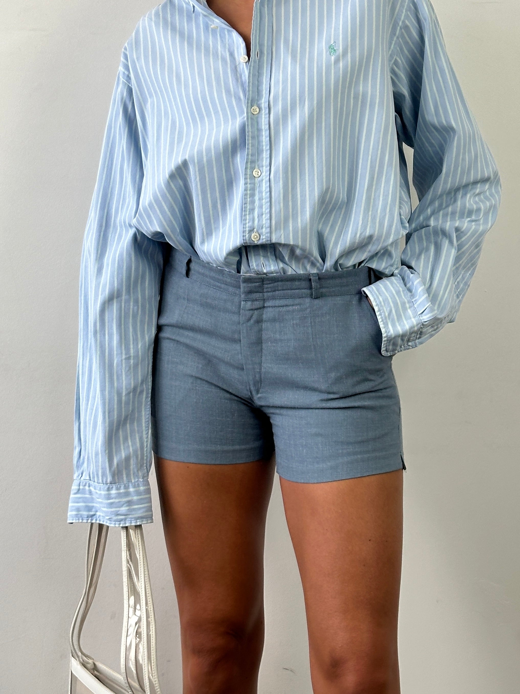 Vintage brand vintage low-mid waisted tailored mini shorts in size W30, shown on a model with a casual background.