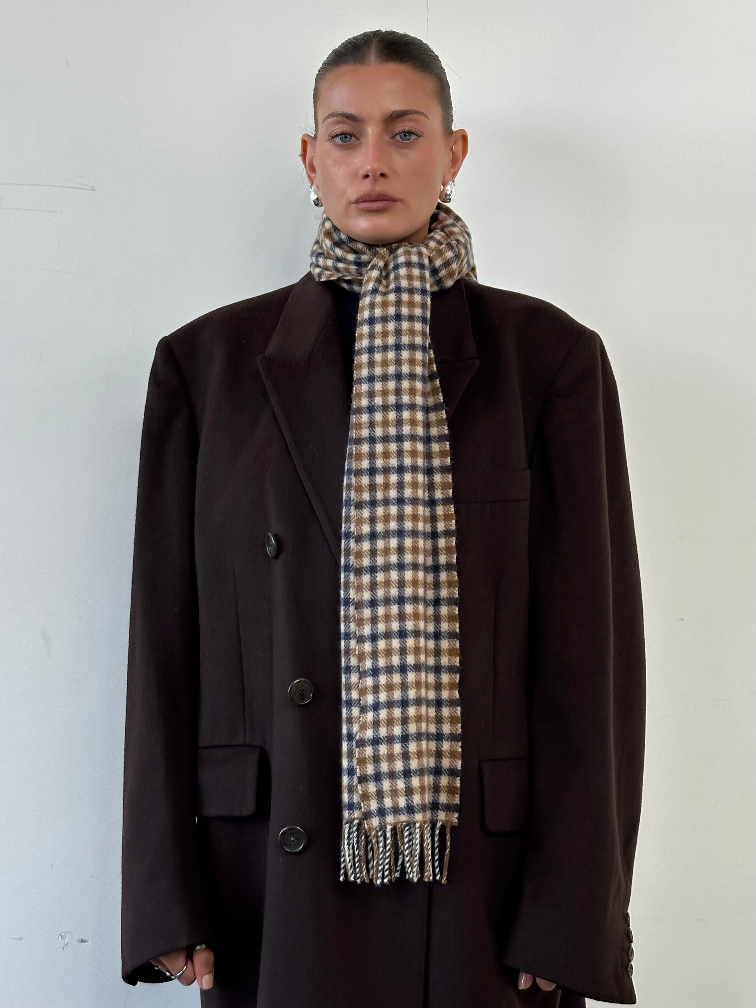 Aquascutum cashmere wool check scarf with classic plaid pattern, soft and warm accessory for cold weather.