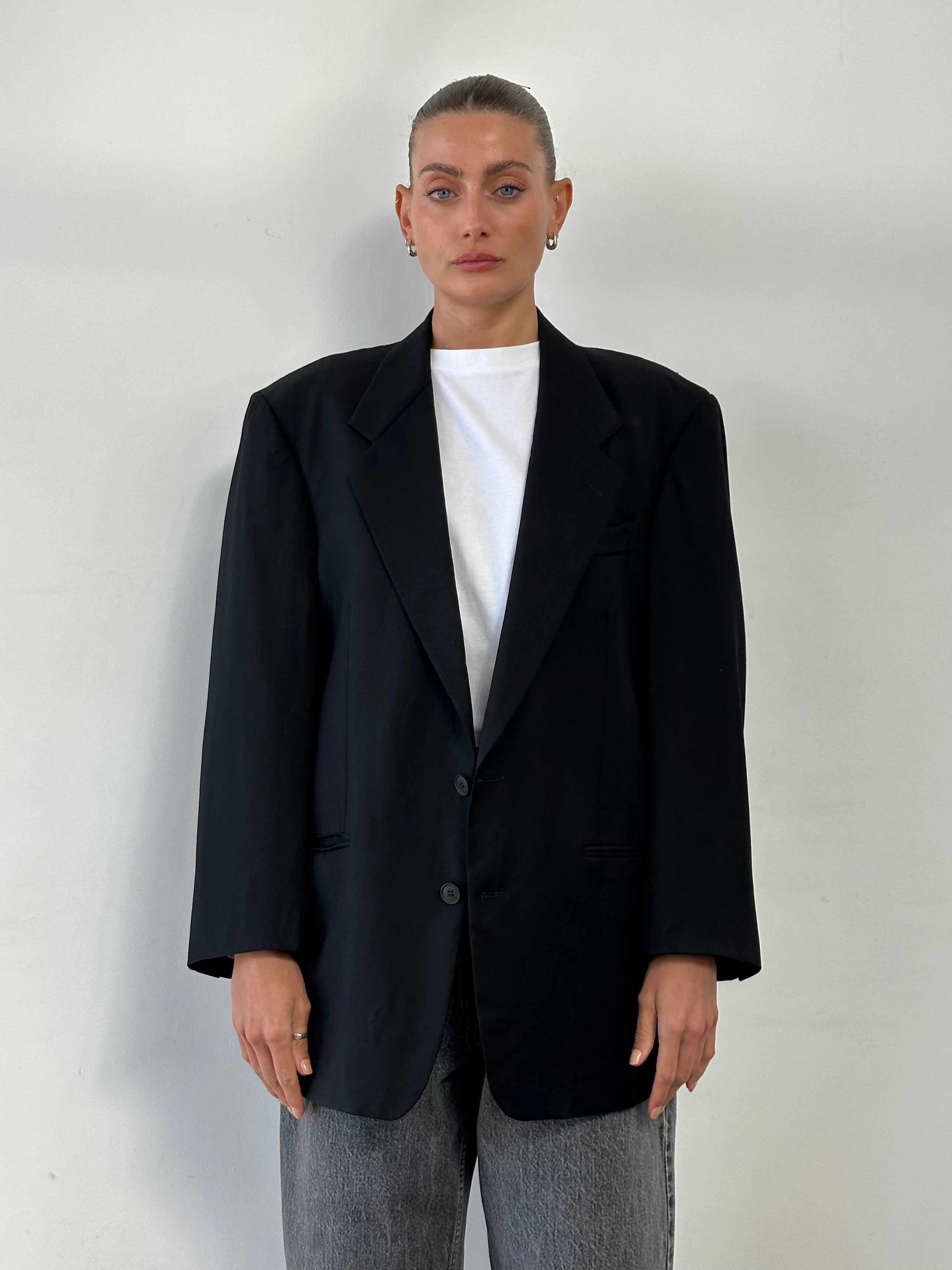 Yves Saint Laurent 90s pure wool single-breasted blazer in size 44R/L, tailored fit with classic lapel and button closure.
