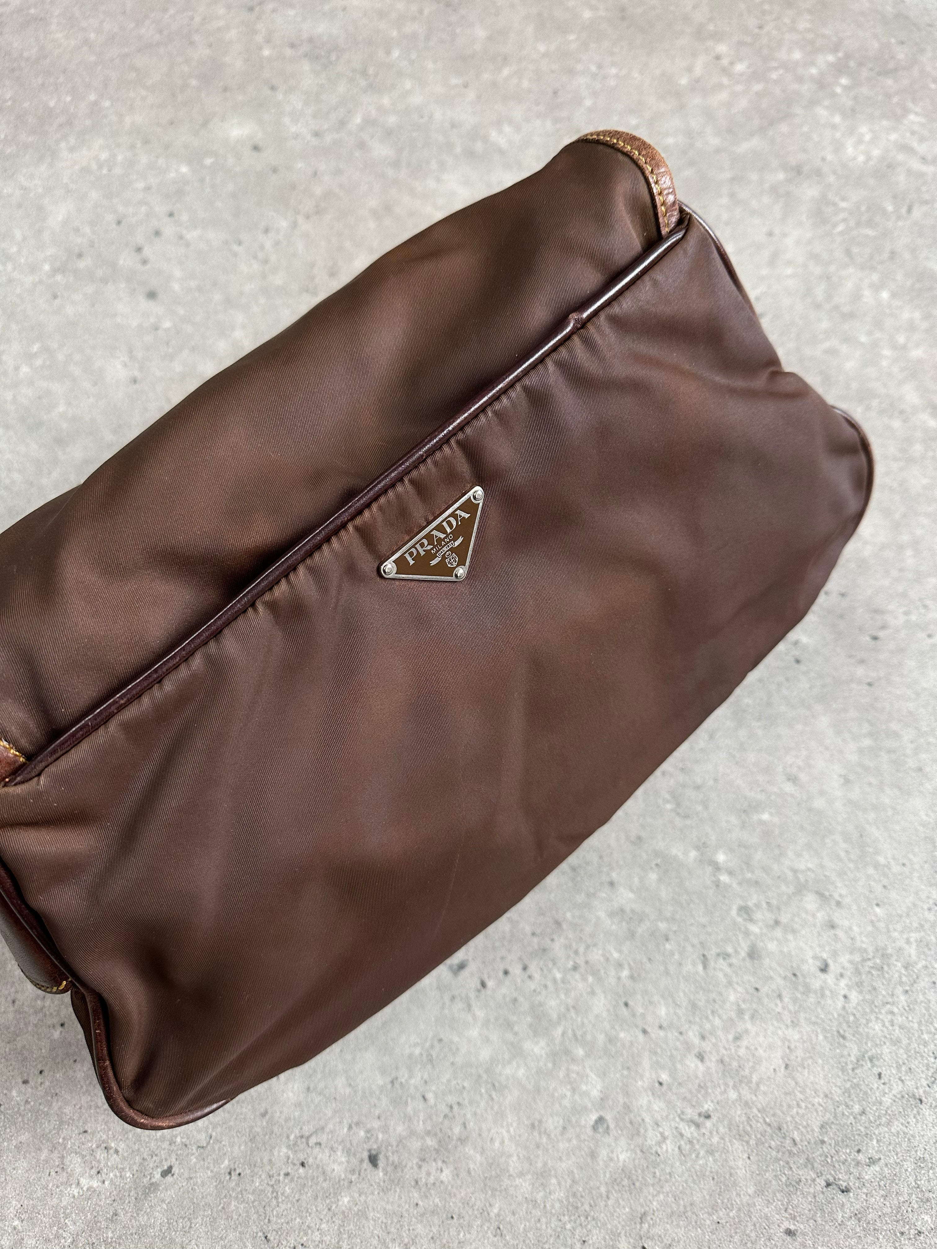 Prada 1990s nylon crossbody bag with adjustable strap and classic design, featuring the iconic Prada logo.