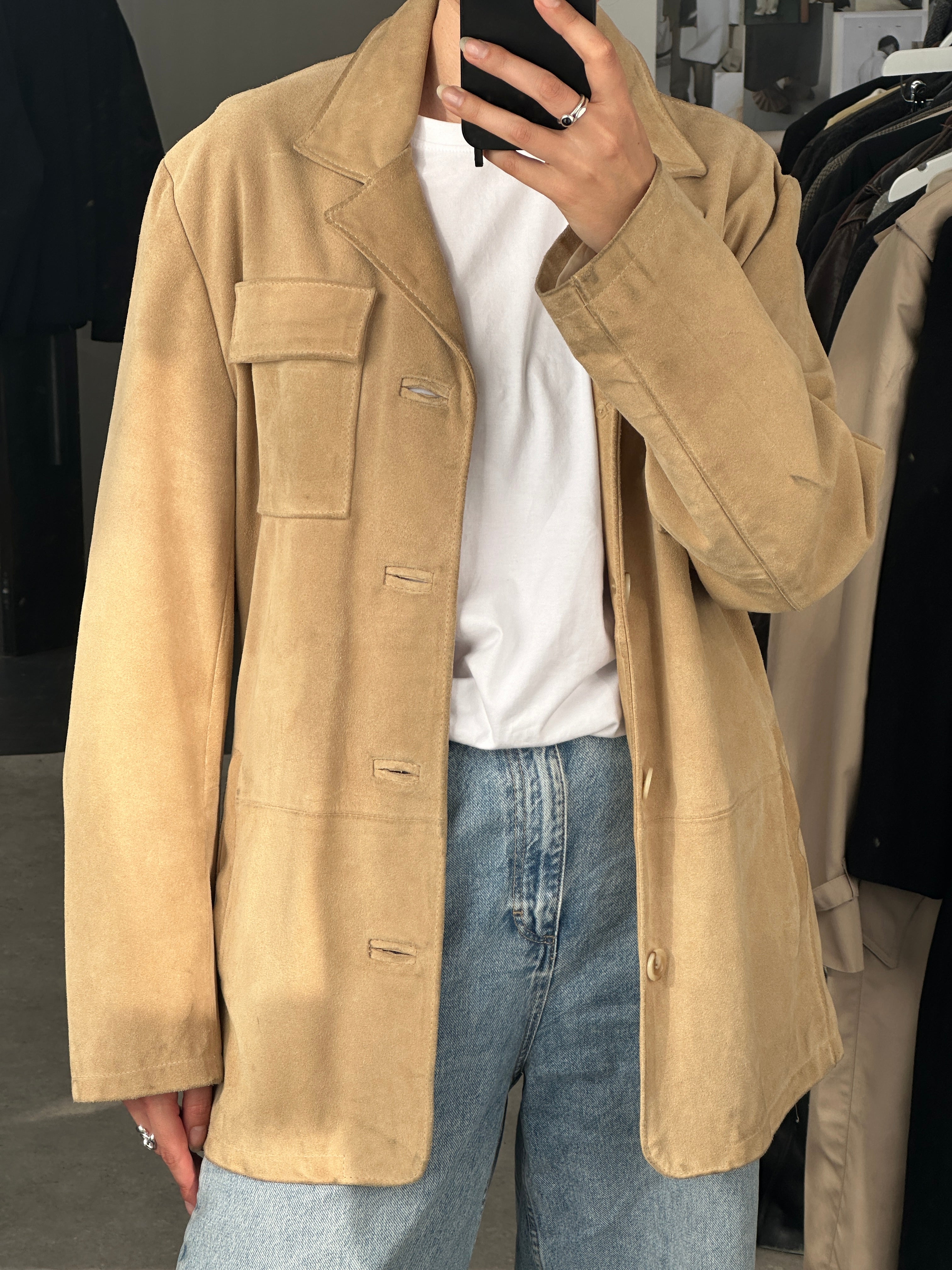 Italian Vintage suede jacket in size L, featuring classic design and soft leather texture, displayed on a hanger.