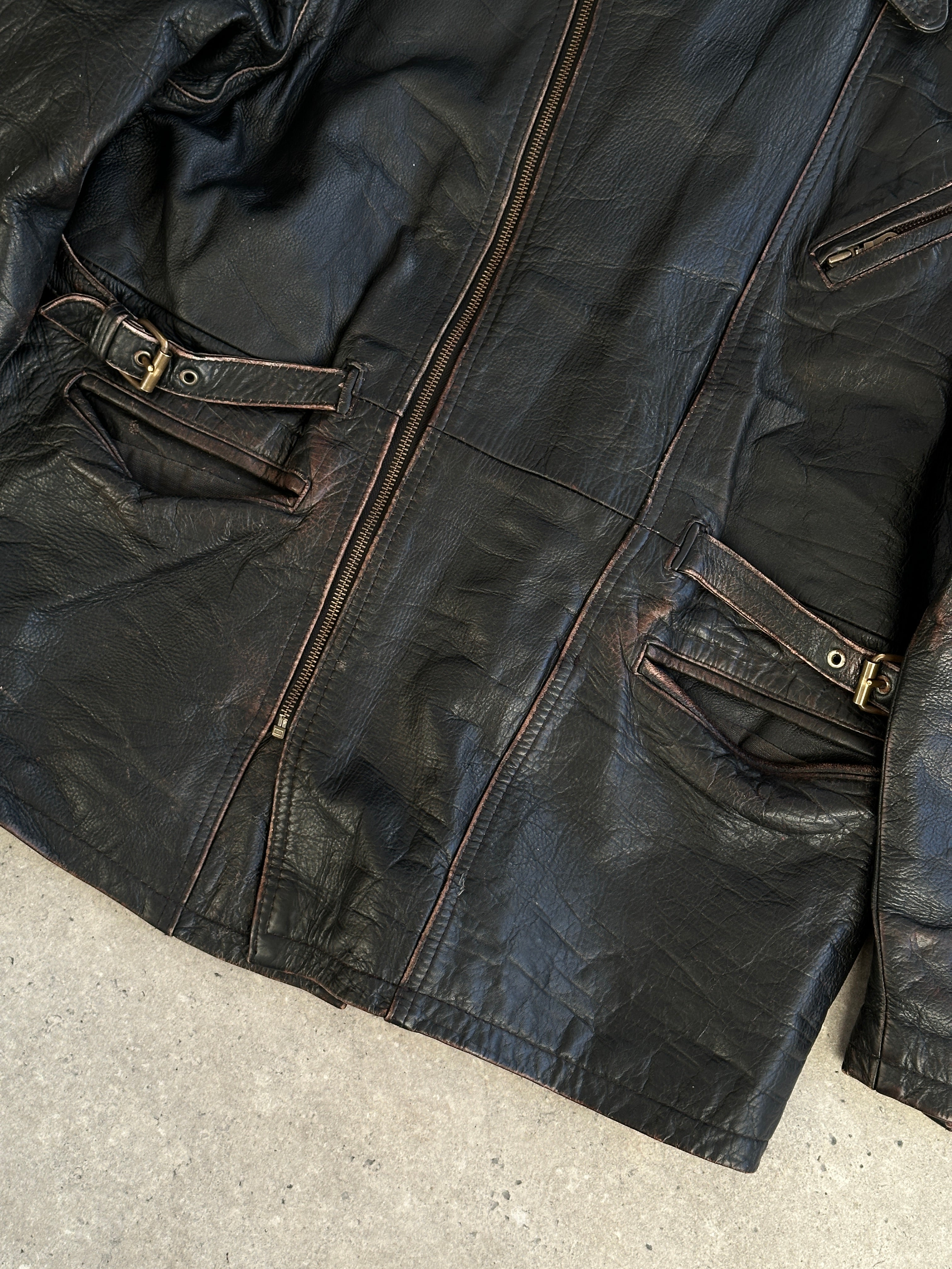 Vintage distressed leather jacket in XL size, featuring rugged leather with a worn-in look and classic design.