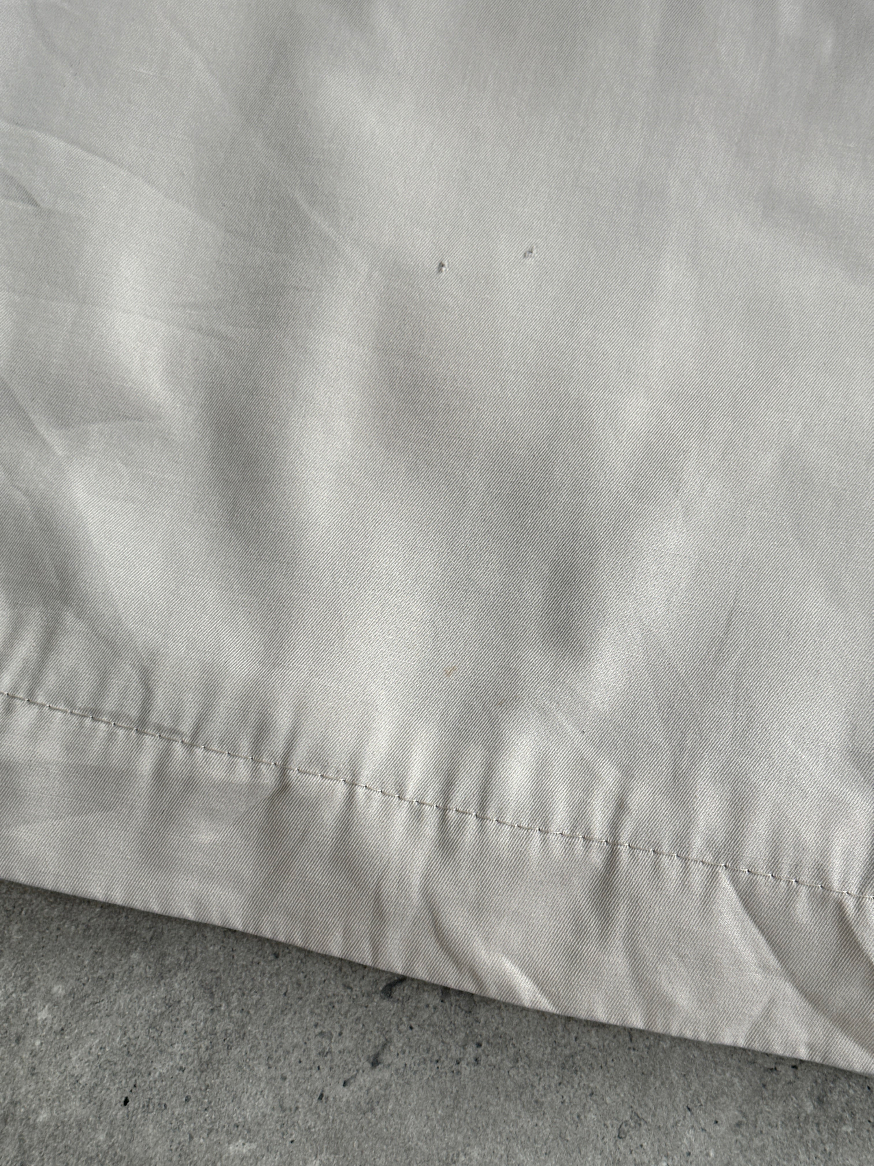 Burberry Nova Check logo bomber jacket in size large, featuring check pattern and classic style, displayed on a hanger.