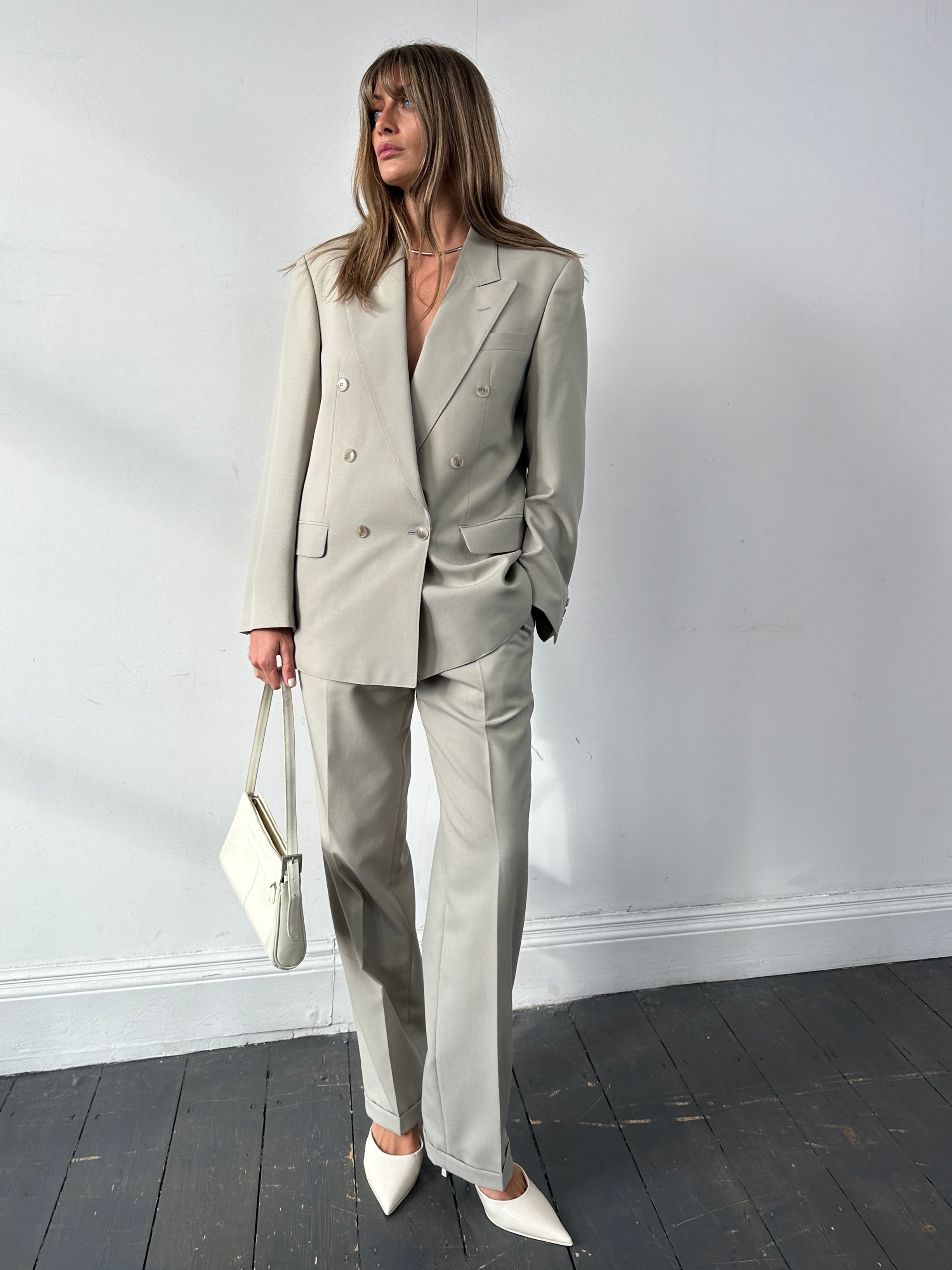Vintage wool double-breasted suit jumpsuit in size 40R/W30, featuring classic lapels and tailored fit, in a vintage style.