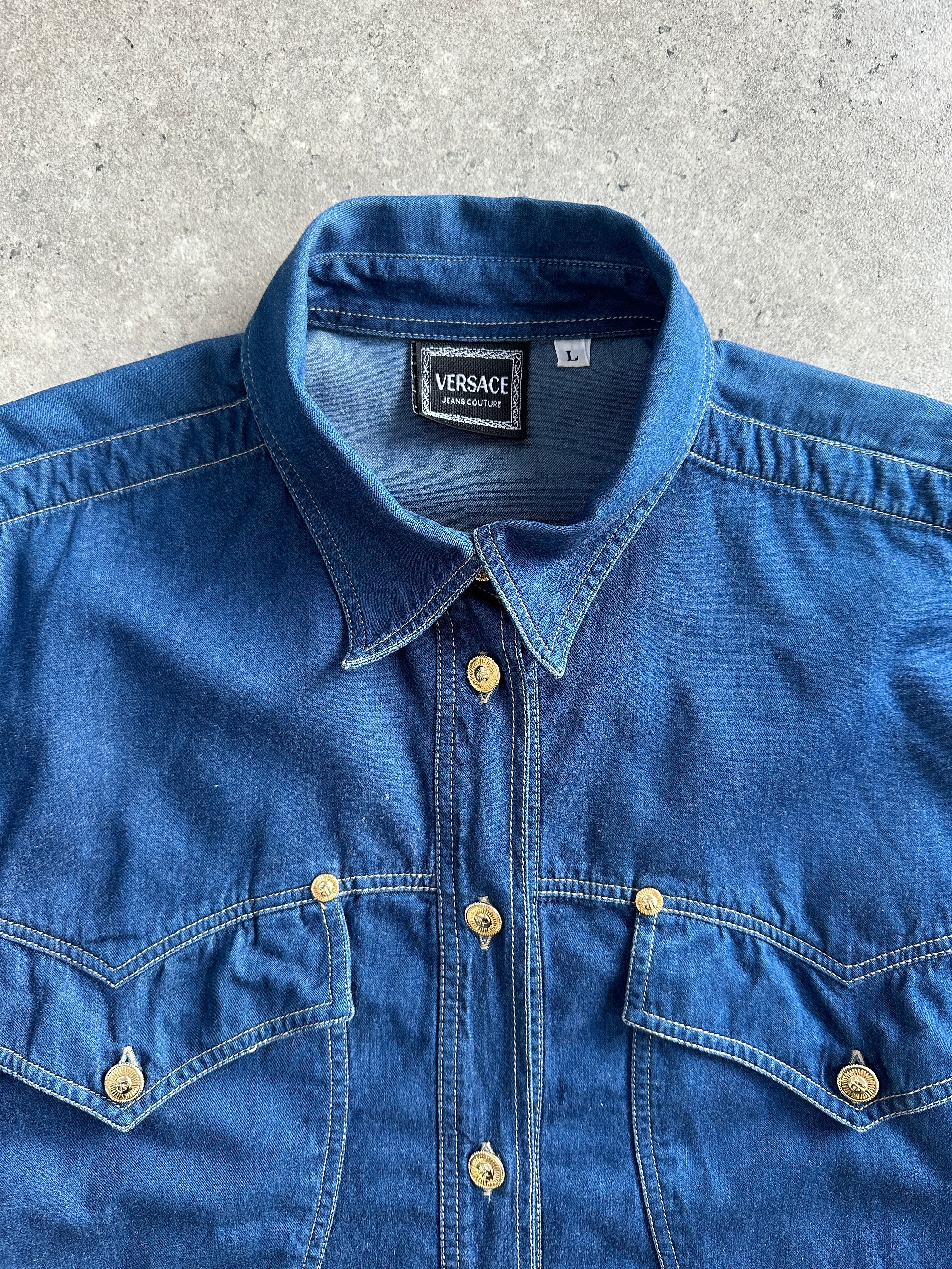 Versace Jeans Couture Sun God denim shirt in size L, featuring the iconic Sun God graphic and classic denim design.