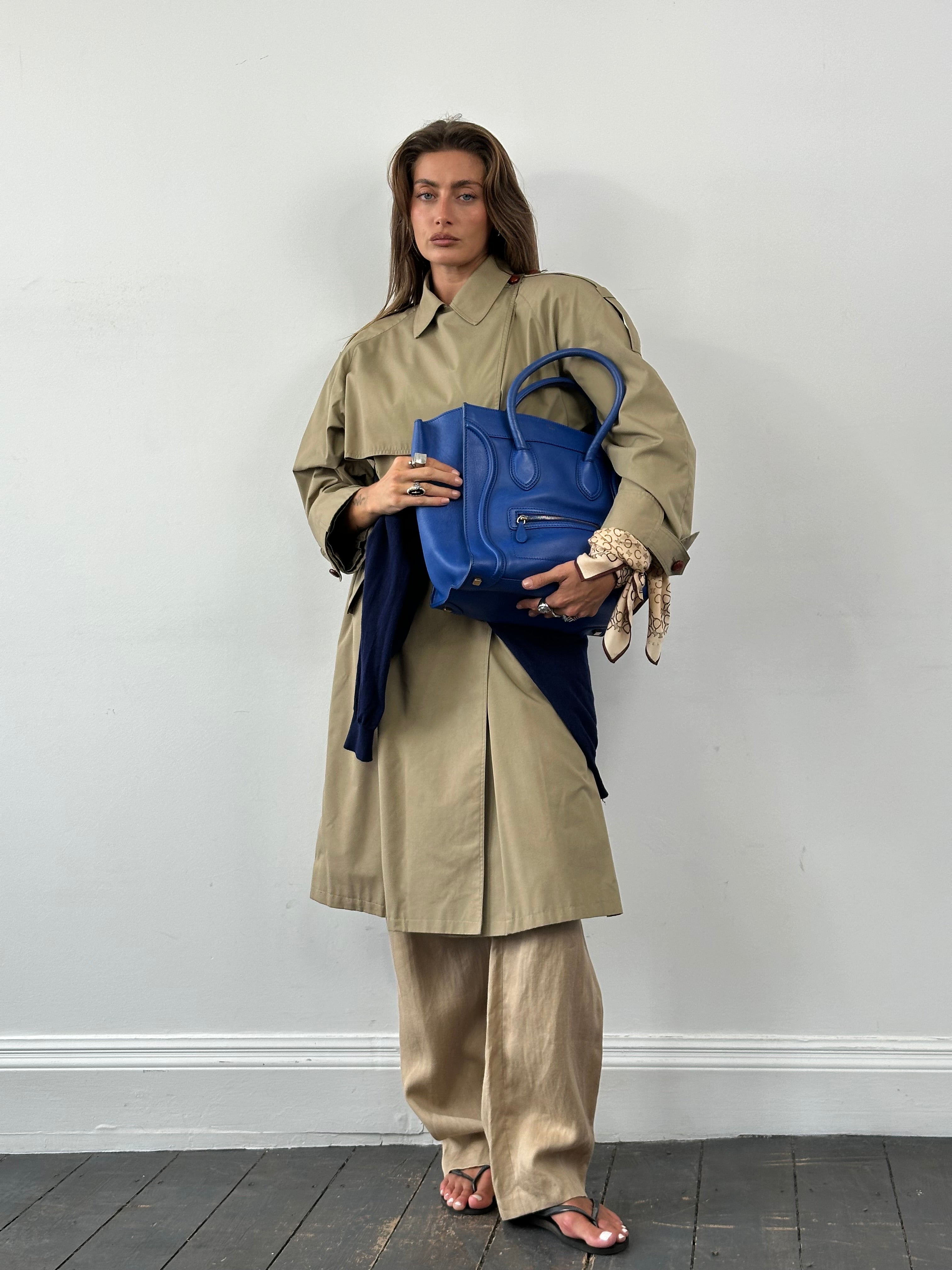 Vintage 1980s Nova Check belted trench coat, mid-length with classic check pattern and waist belt, in size M.