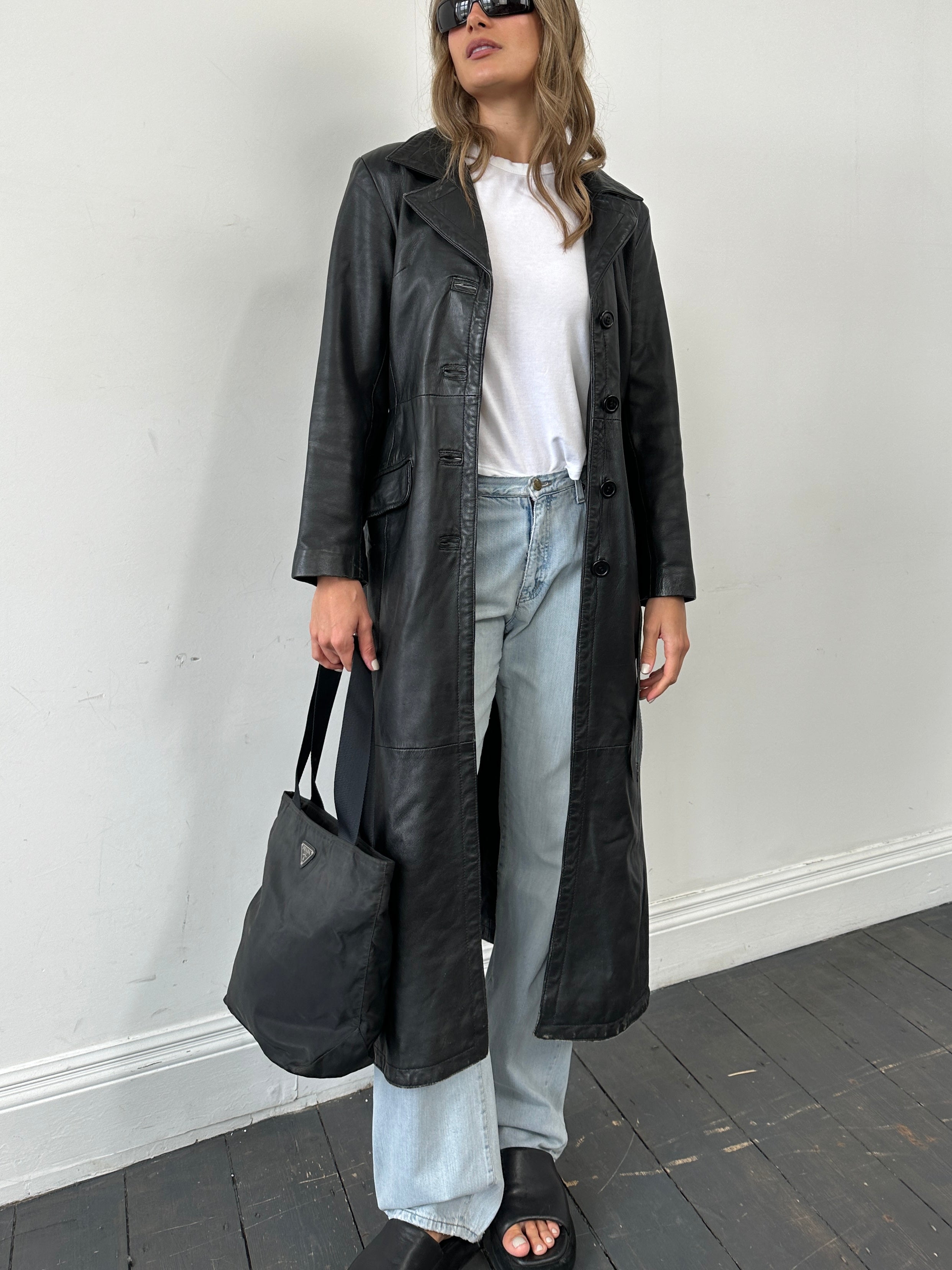 Vintage leather belted trench coat, floor-length jacket in size S, featuring classic design and stylish vintage fashion details.