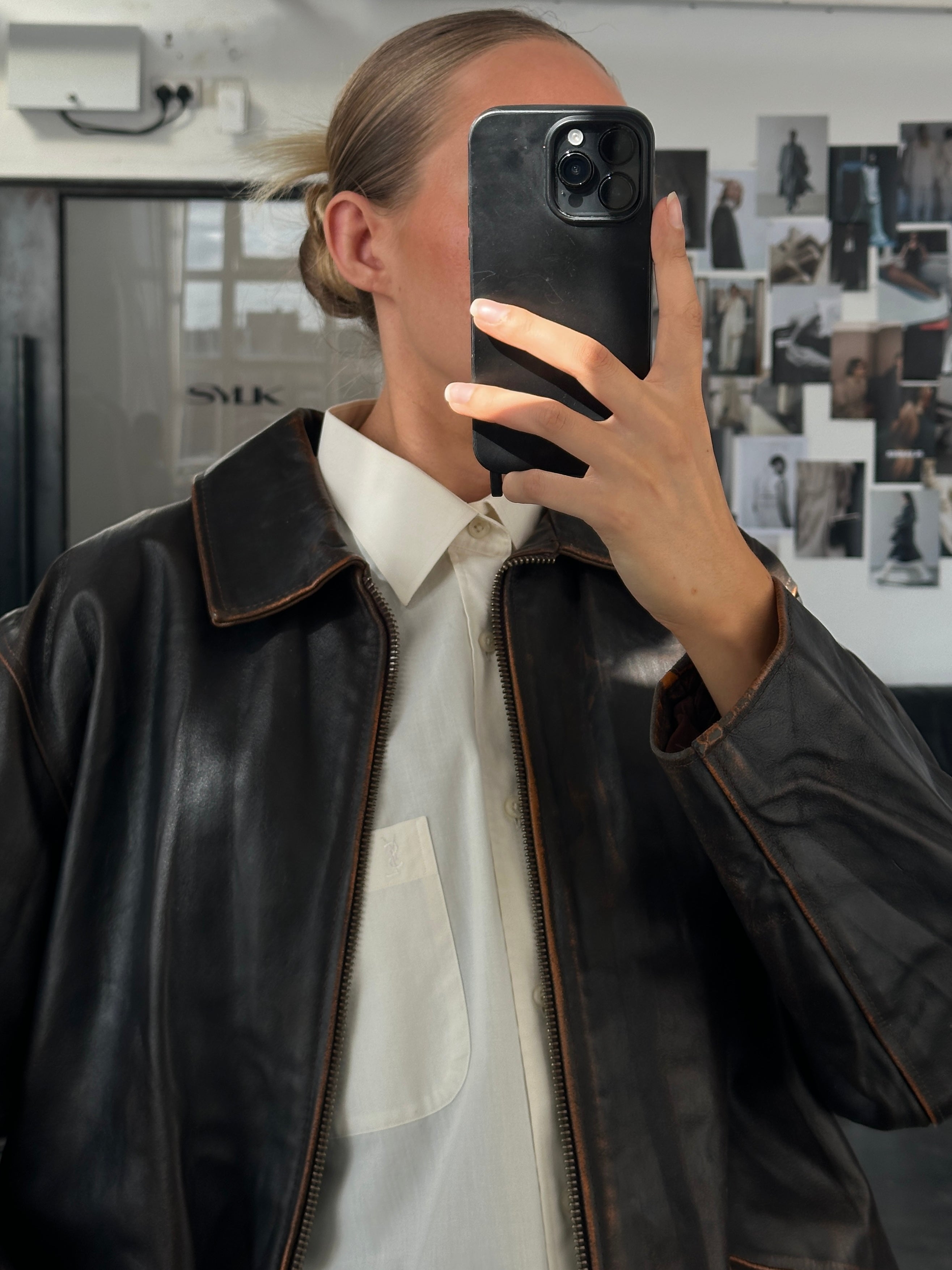 Vintage Italian 1990s distressed leather jacket, size L/XL, showcasing rugged, worn-in style with classic leather texture and vintage details.