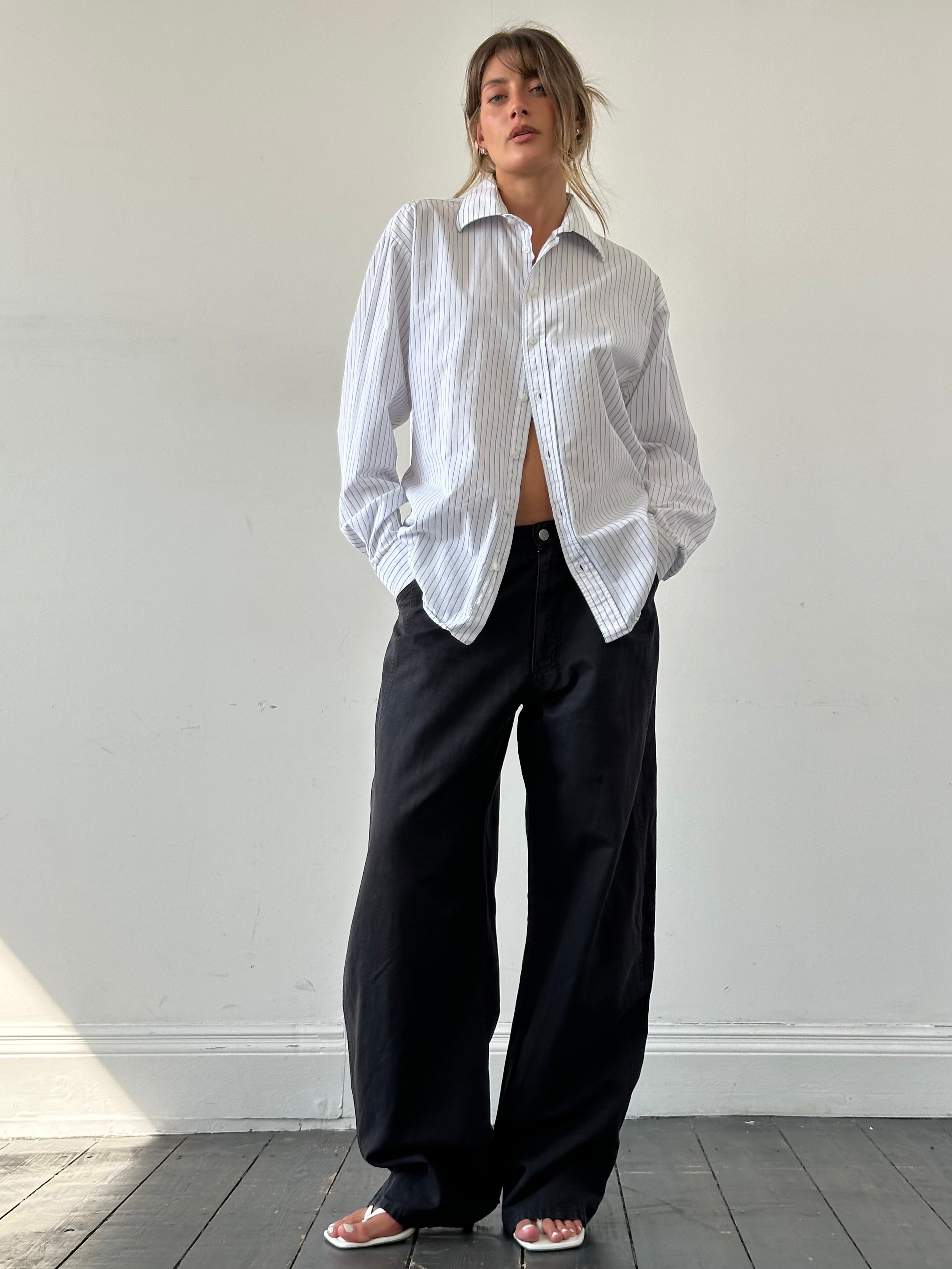 Armani Jeans cotton wide-leg trousers in size W32, featuring a relaxed fit and classic design, shown on a neutral background.