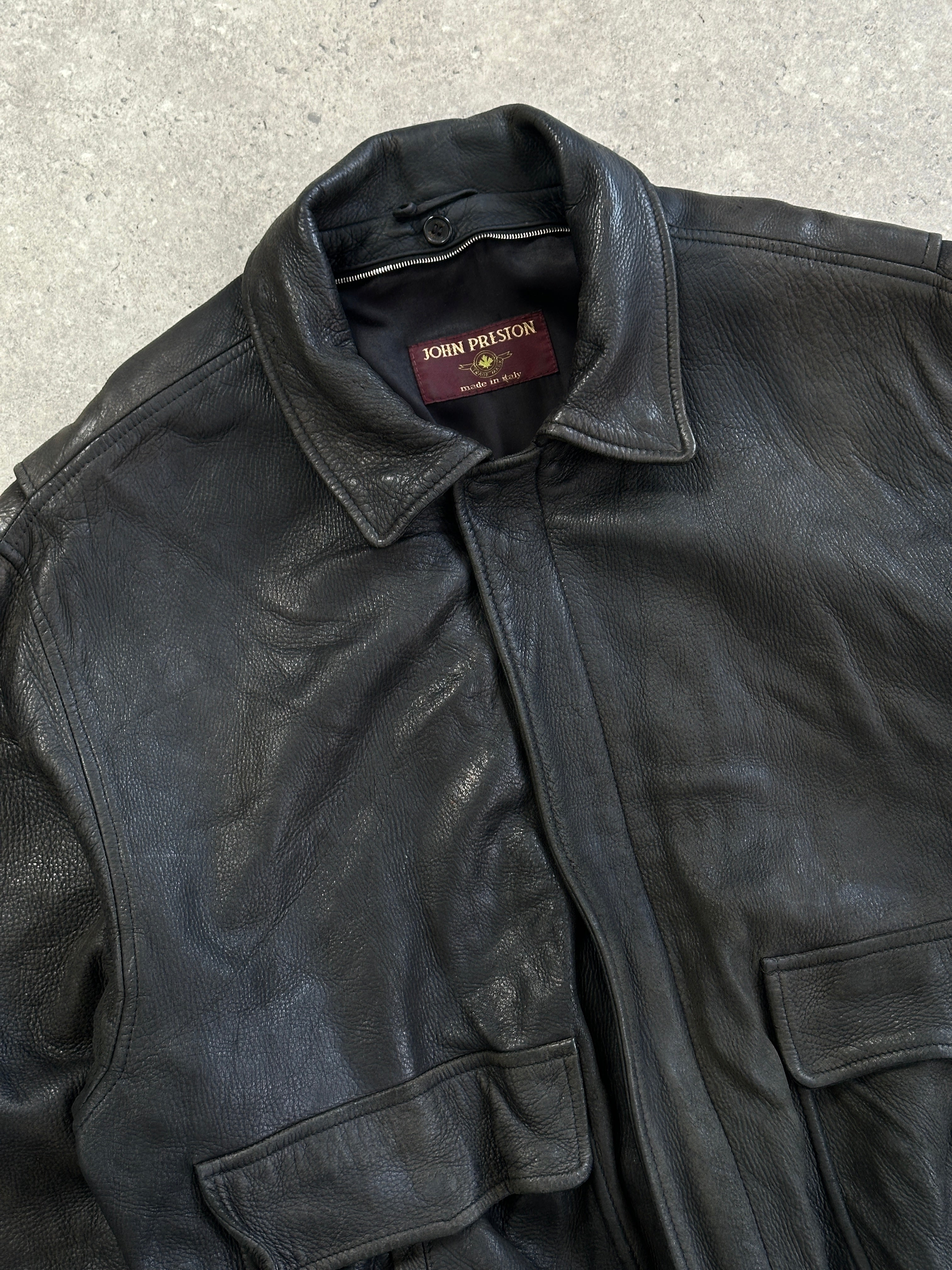 Vintage Italian vintage aged leather bomber jacket in XL, featuring classic style and distressed leather texture.