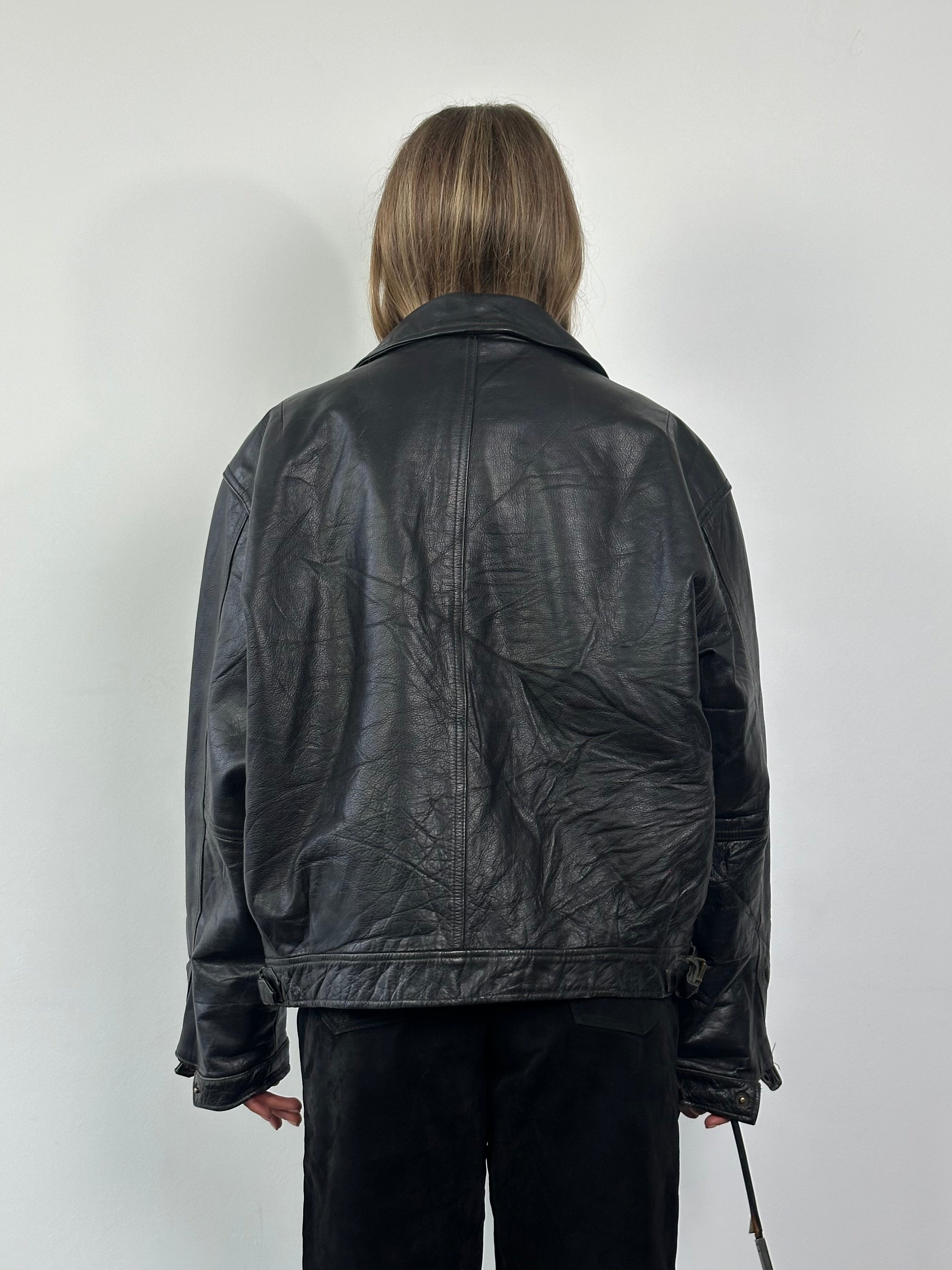 Vintage leather jacket in size XL, featuring classic design with smooth brown leather and detailed stitching.