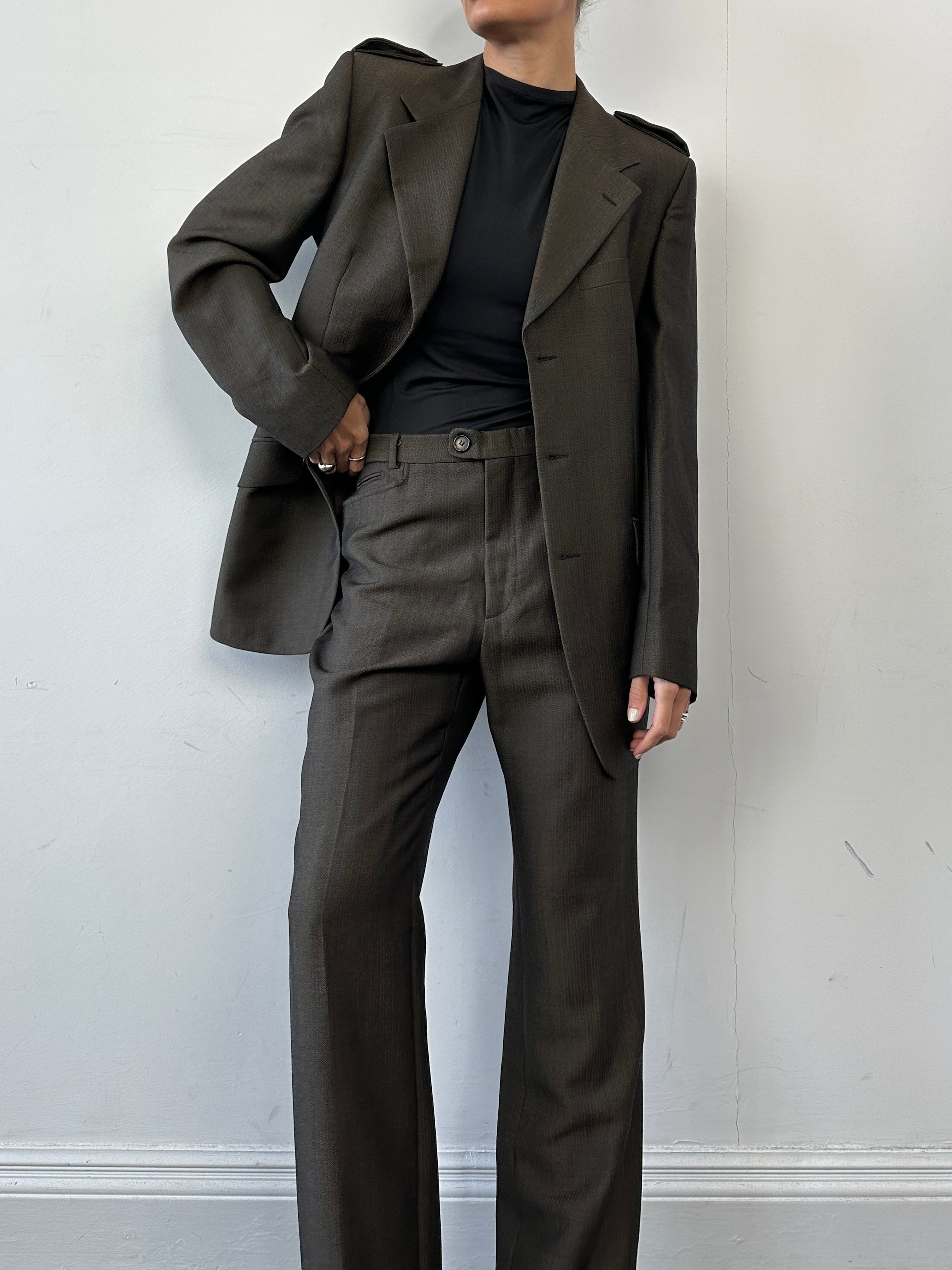 Gucci wool mohair single-breasted jumpsuit in size 40L/W30, featuring tailored fit and classic design, displayed on a hanger.