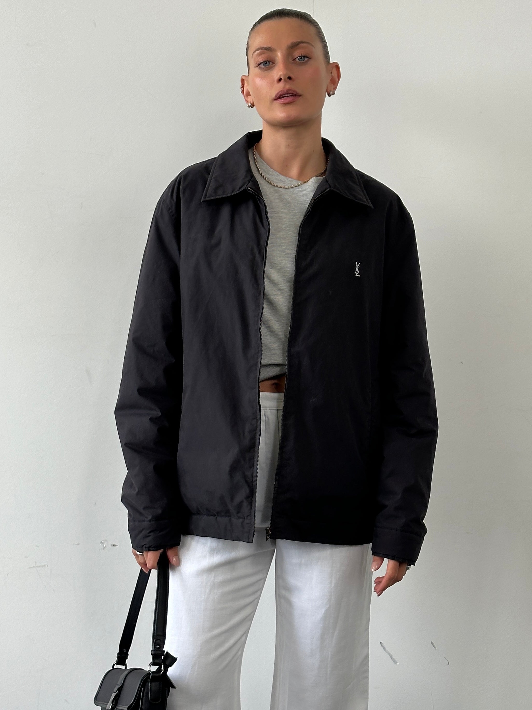 Yves Saint Laurent Pour Homme padded logo bomber jacket in size XL, black with embroidered brand logo on front and quilted design.