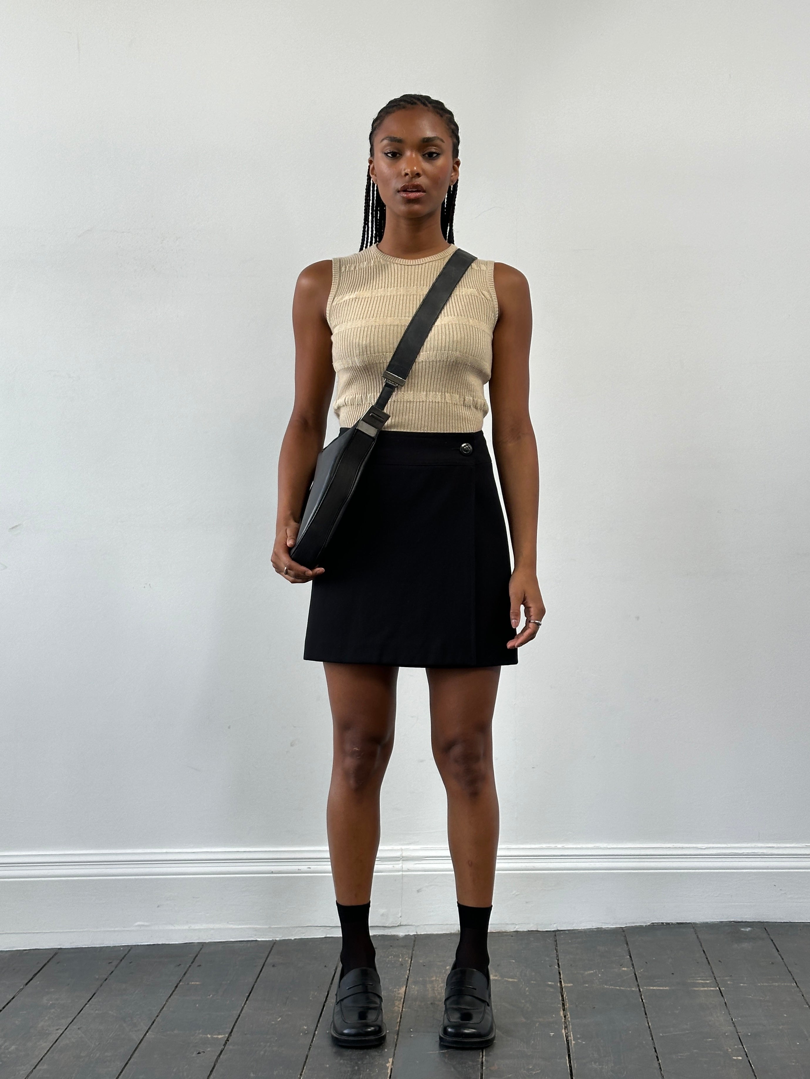 Vintage Italian 1990s wrap mini skirt in W28, featuring retro floral pattern and classic design.