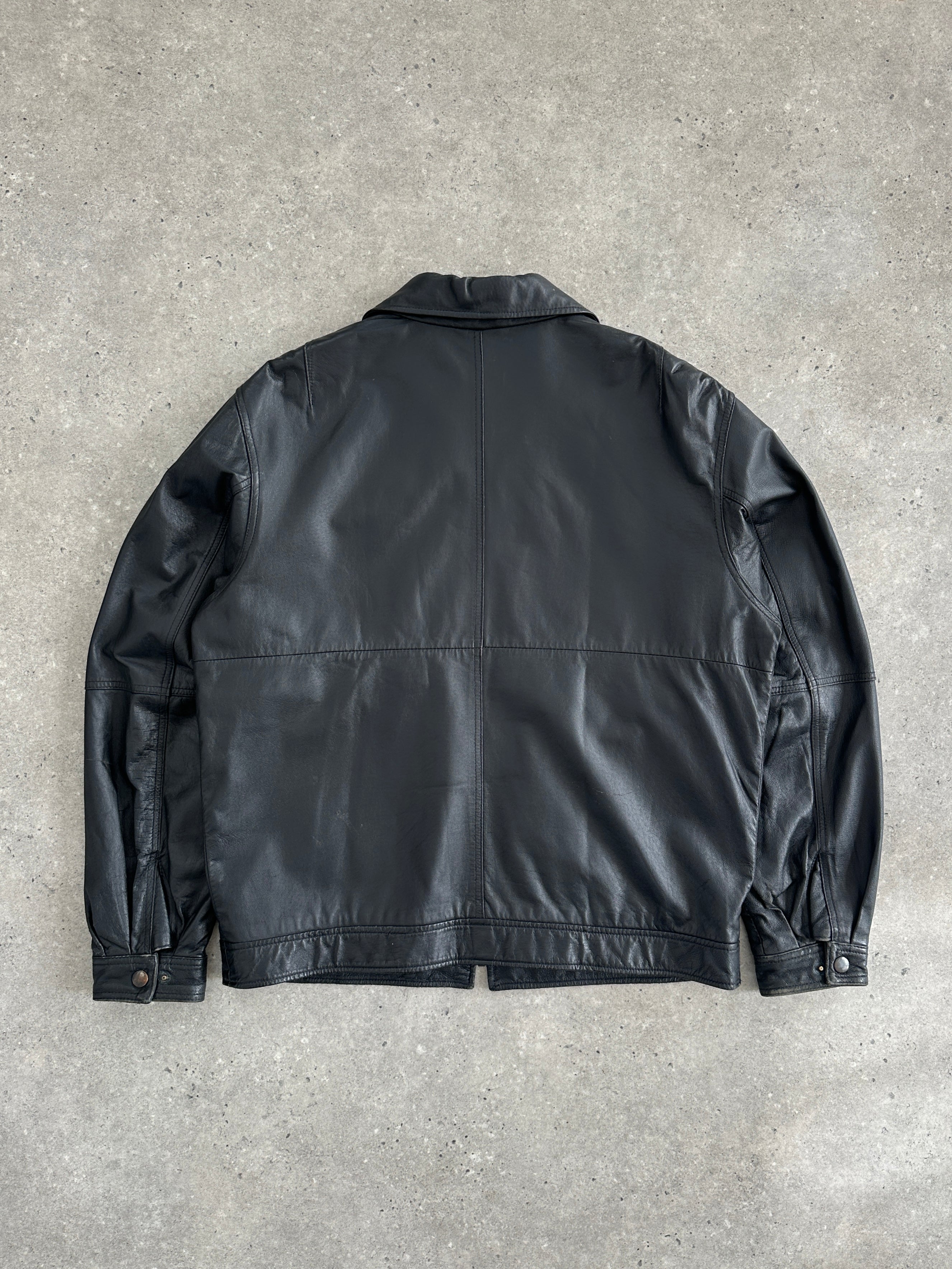 Vintage 1990s minimal leather jacket in size L/XL, showcasing sleek design and classic black leather with clean lines.