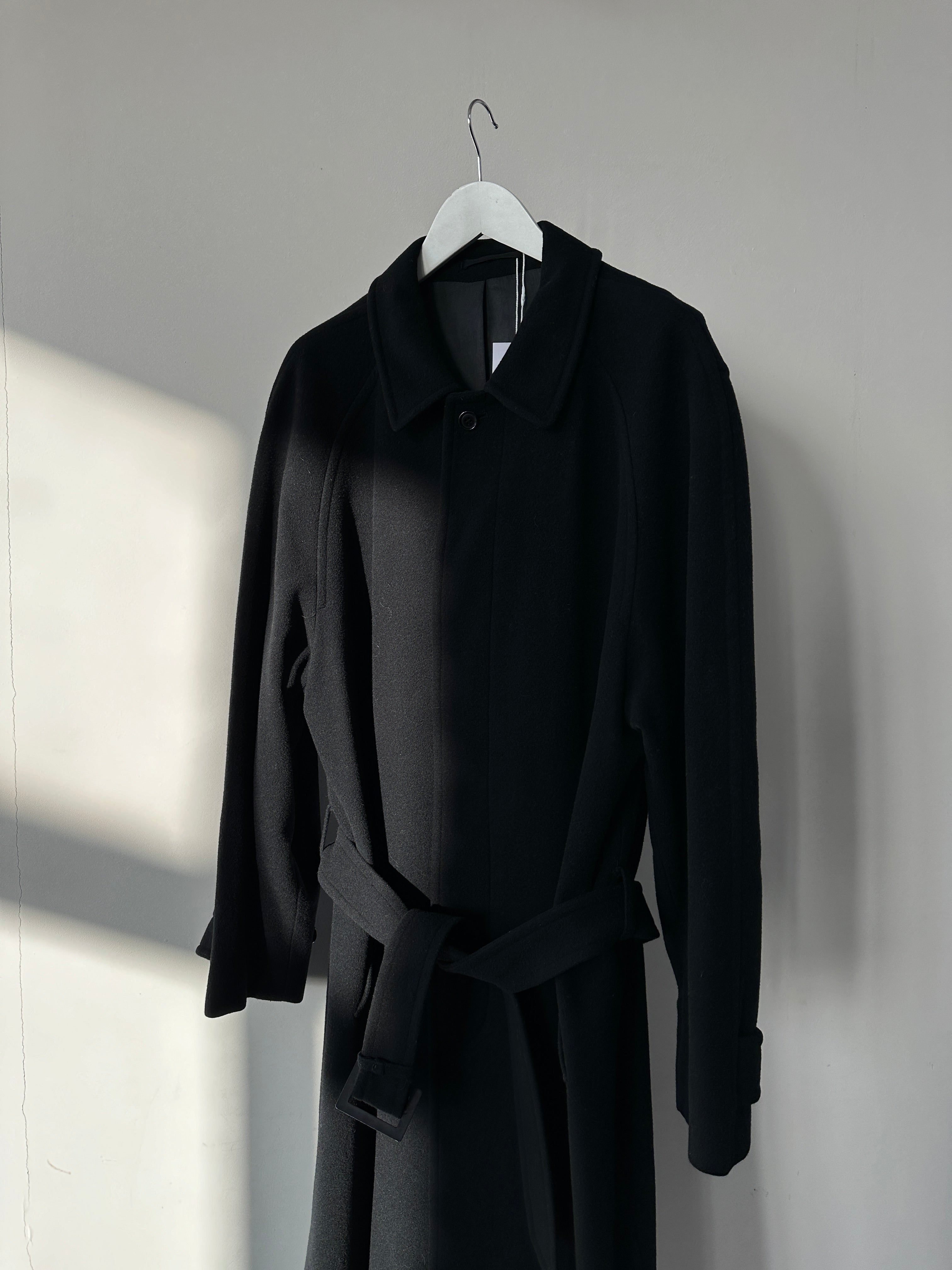 Vintage wool cashmere coat with concealed placket, belt, and XL size, shown hanging on a wooden hanger.