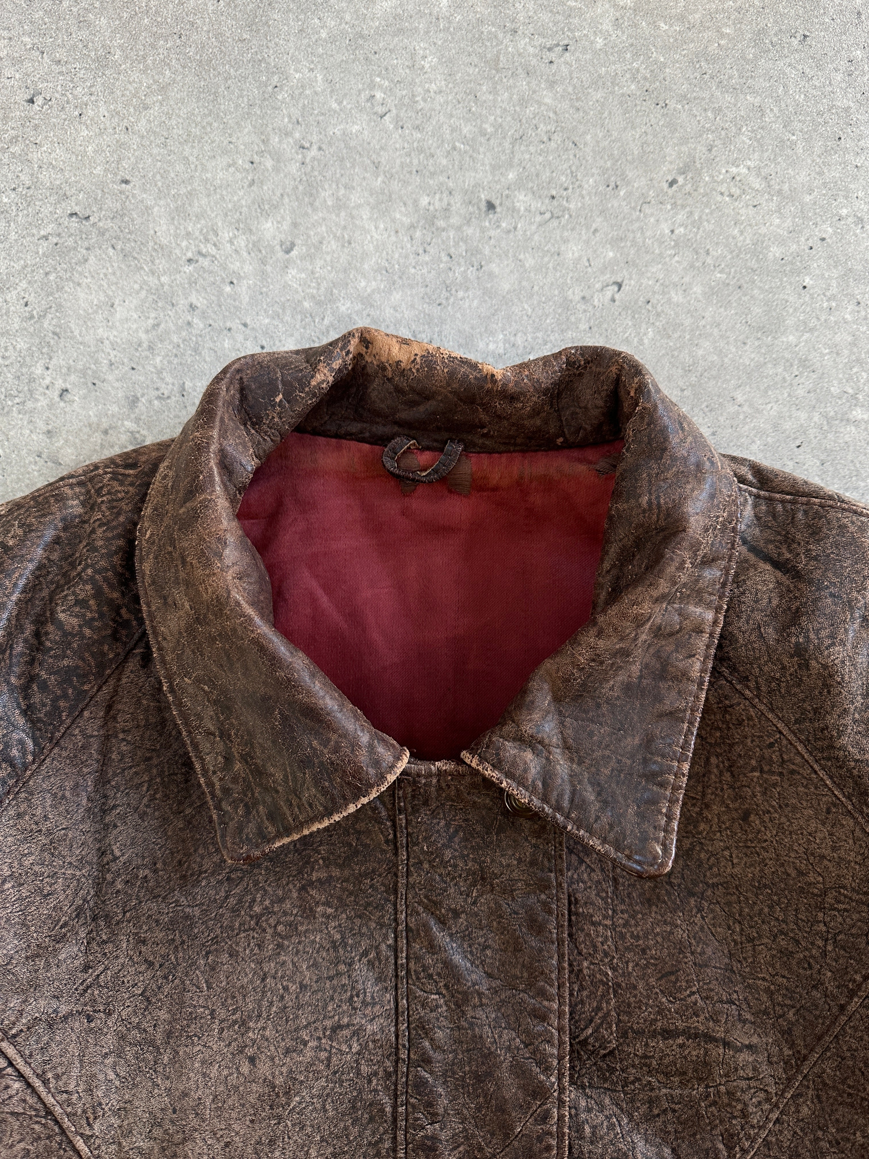 Vintage brand vintage 1980s aged leather jacket in size small, featuring distressed brown leather and classic style.